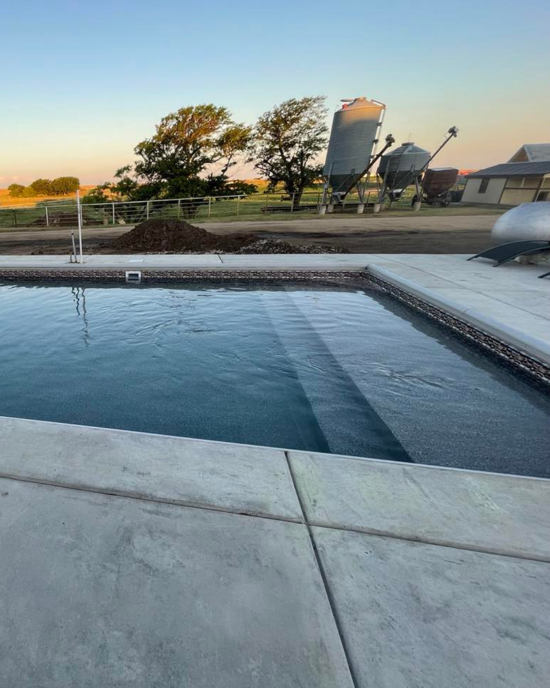 Stadium steps with a tanning ledge built by Super Pools in Kansas