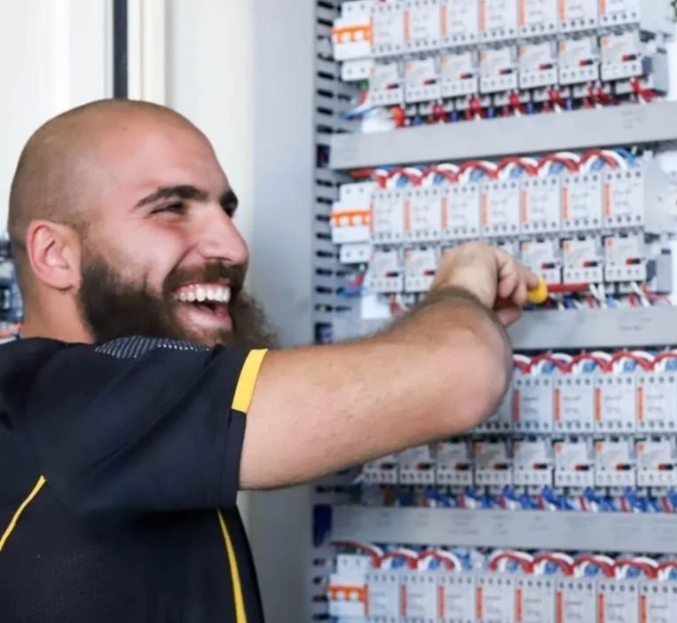 Flash Electrical Electrician Working on a Panel. Electrician company Adelaide