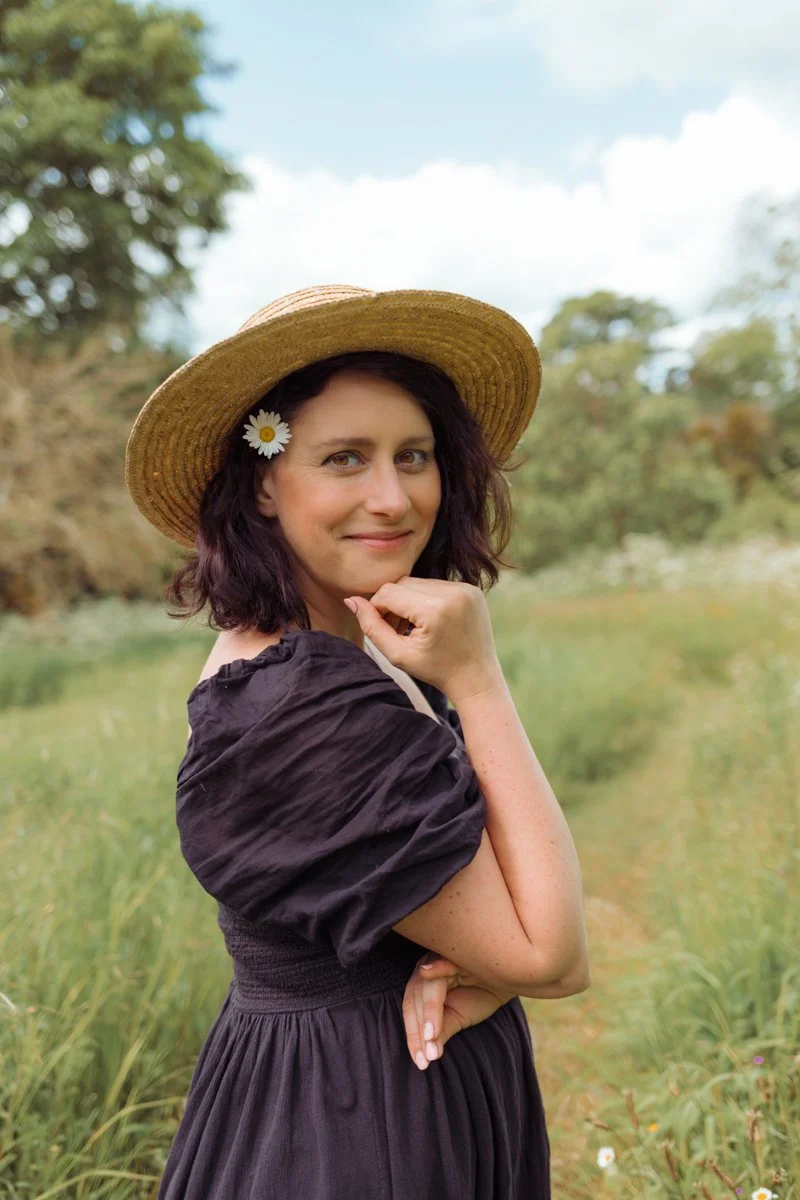 Photographer smiling at camera in nature