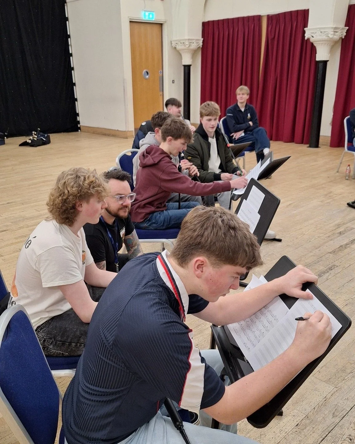 Ali Hutton (@fromthegroundband) led a harmony and composition workshop with the Senior Band as part of NYPBS rehearsals 🎵

The band had a go at writing harmony parts and they sounded amazing! ✨

Now they're gearing up for the end-of-year concert, &l