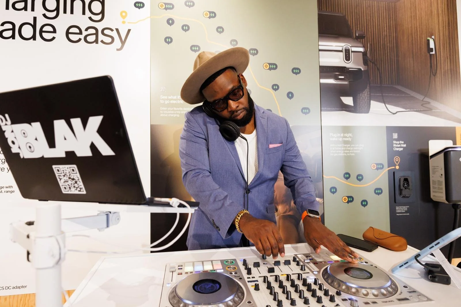 “NYC Wedding DJ & MC DJ Jon Blak mixing music at a branded corporate event, delivering professional DJ services for weddings, corporate events, and sports events in New York City.”