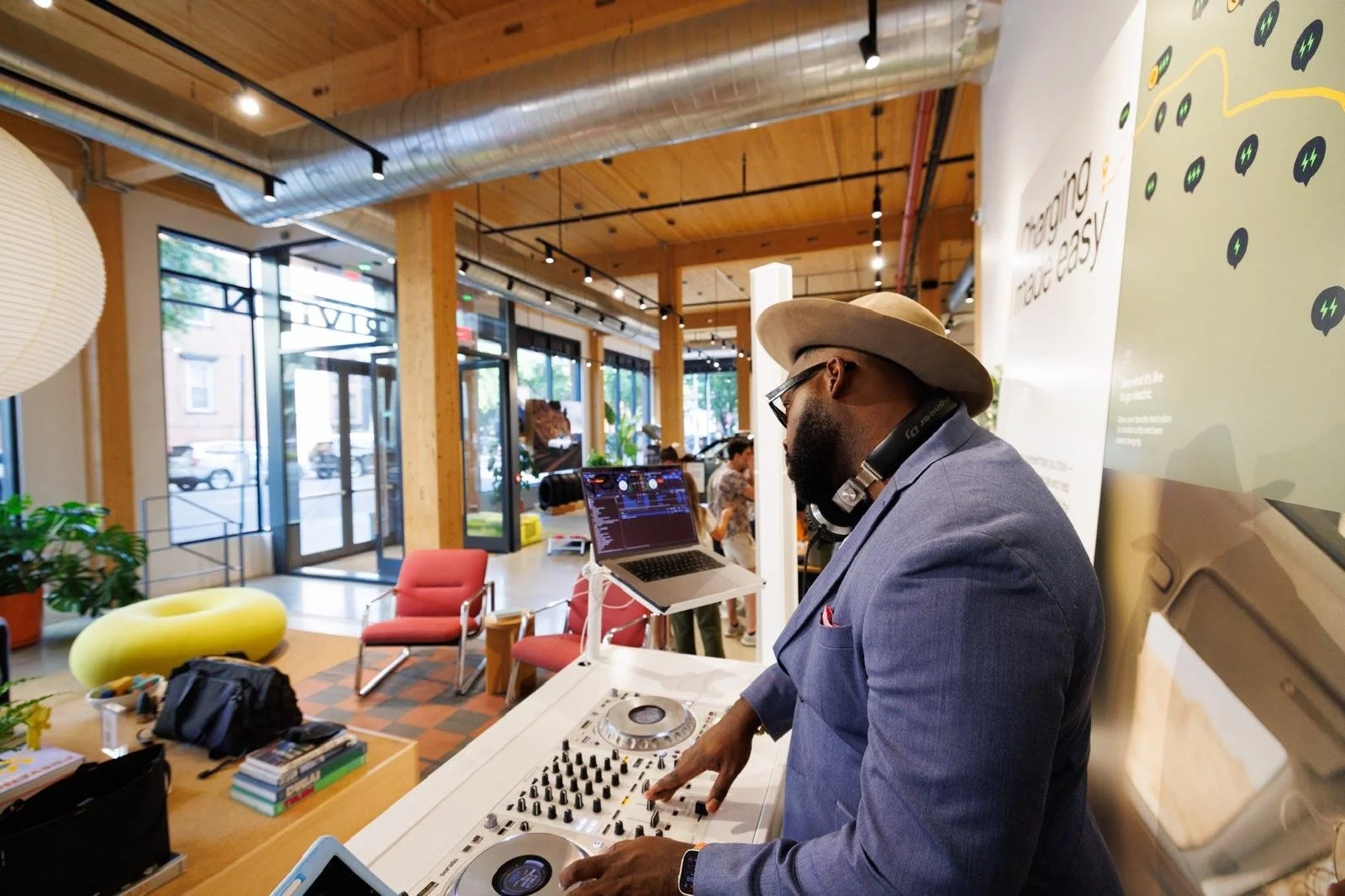 “NYC Wedding DJ & MC DJ Jon Blak performing live at a modern corporate activation, delivering professional DJ services for weddings, corporate events, and sports events in New York City.”