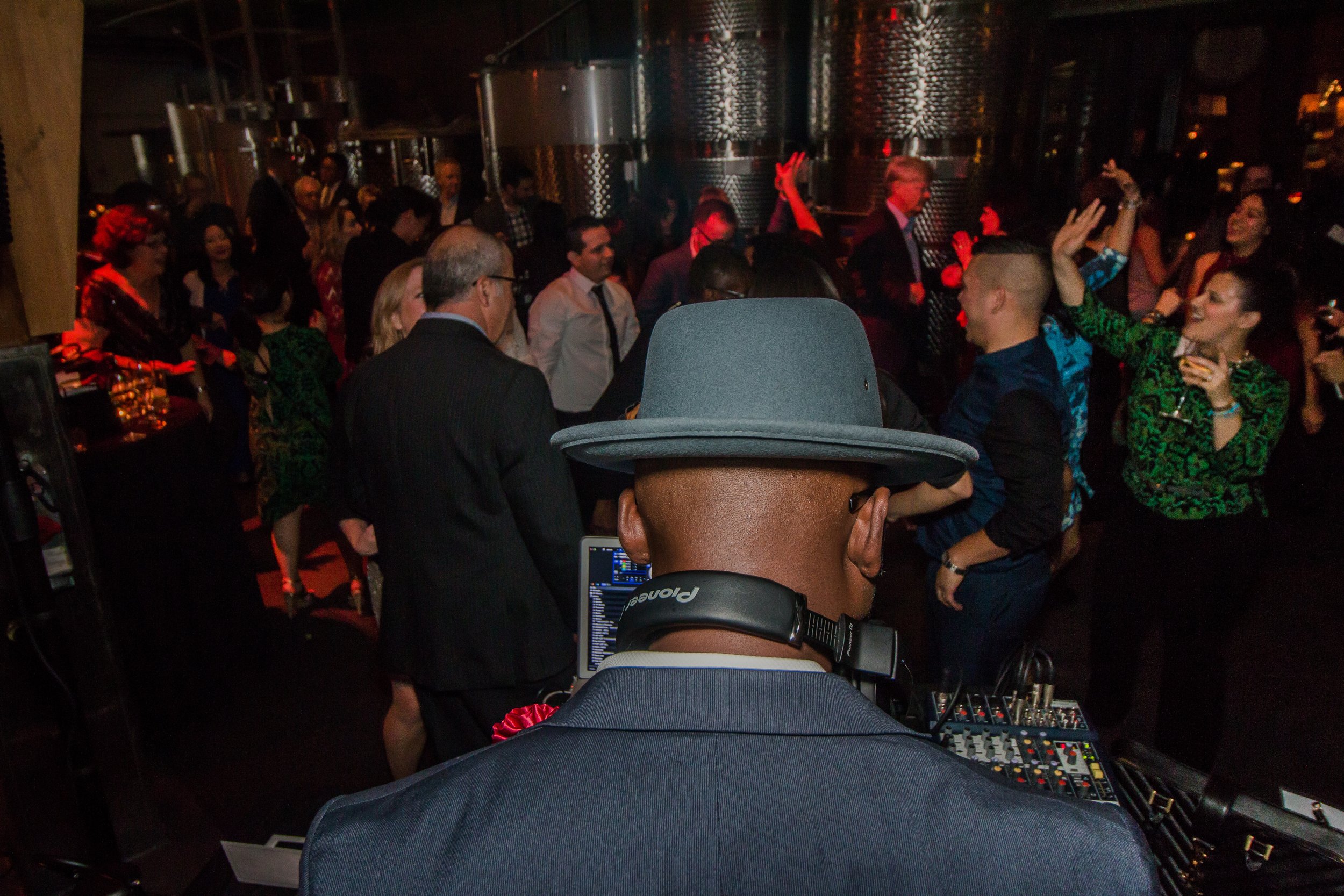 “Corporate Event DJ NY performing at a company party, providing music and entertainment for company parties and brand events.”