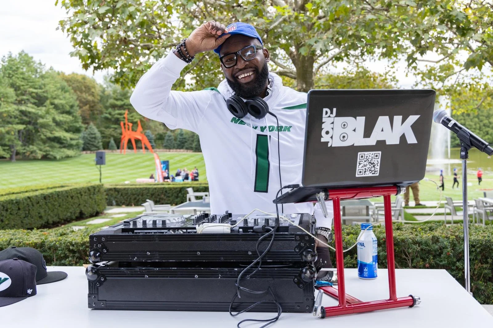 “NYC Wedding DJ & MC DJ Jon Blak performing at an outdoor corporate and sports event, providing professional DJ and MC services for weddings, corporate events, and sports events in New York City.”