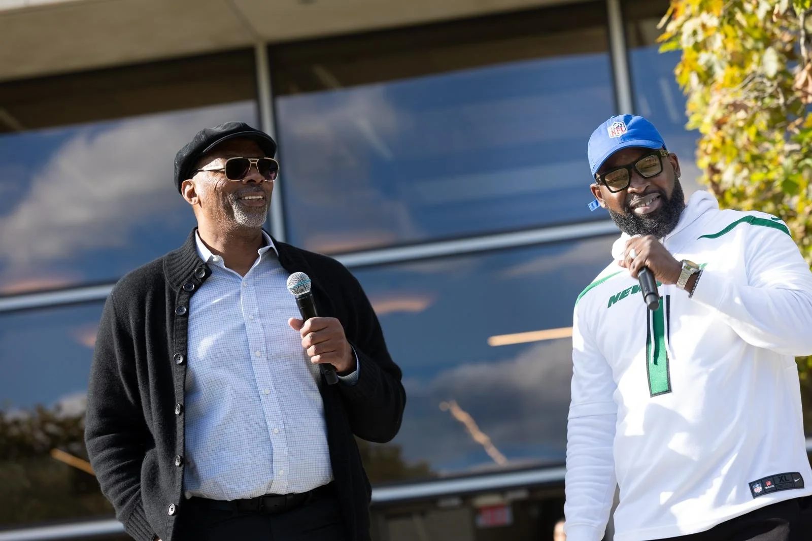 “NYC Wedding DJ & MC DJ Jon Blak speaking at an outdoor corporate event, highlighting professional DJ and MC services for weddings, corporate events, and sports events in New York City.”