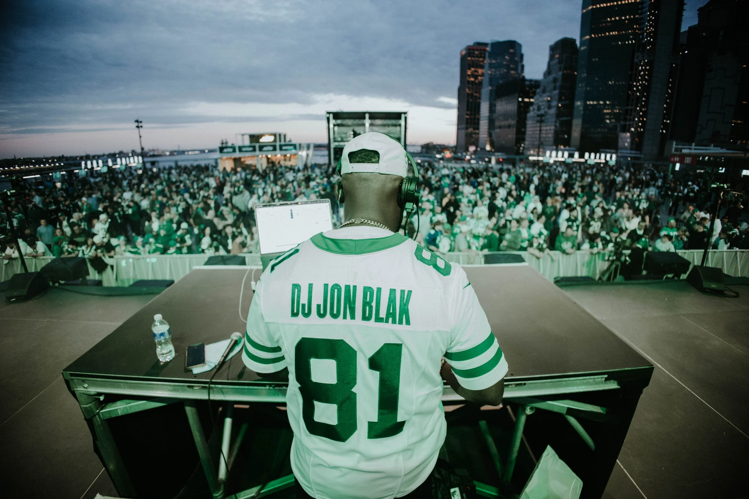“New York Jets DJ Jon Blak performing live at an NFL Pro Bowl Games stadium.”
