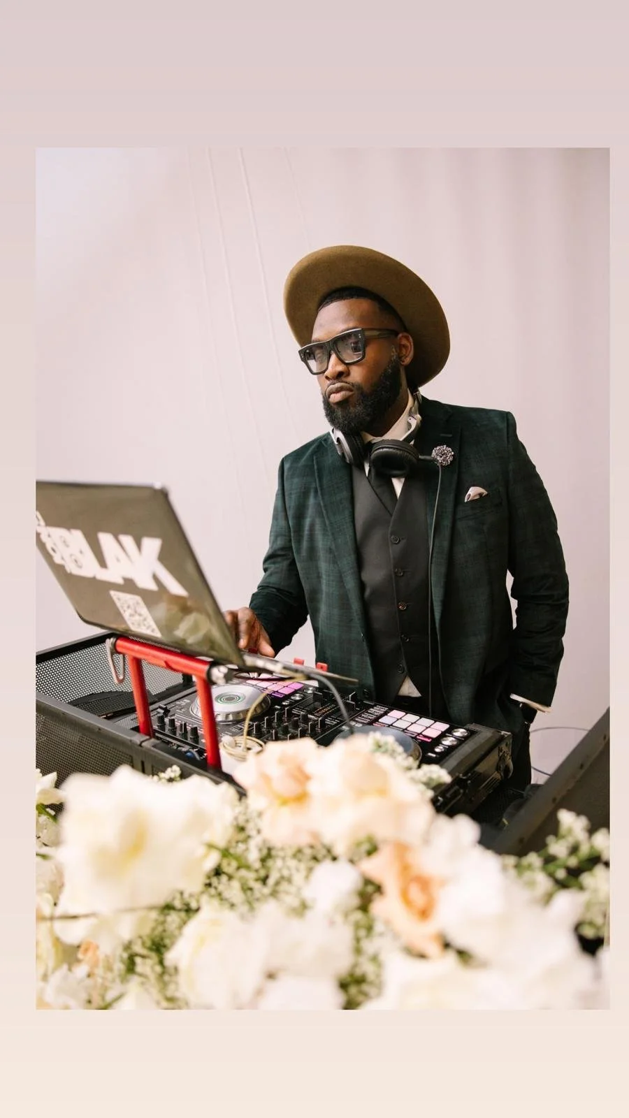 “NYC Wedding DJ & MC DJ Jon Blak mixing music on a professional DJ controller, providing high-end DJ services for weddings, corporate events, and sports events in New York City.”