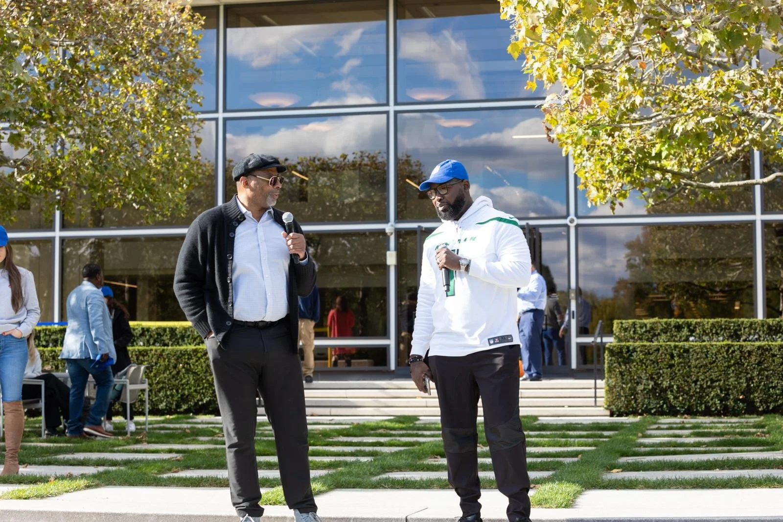 “NYC Wedding DJ & MC DJ Jon Blak speaking at an outdoor corporate event, highlighting professional DJ and MC services for weddings, corporate events, and sports events in New York City.”