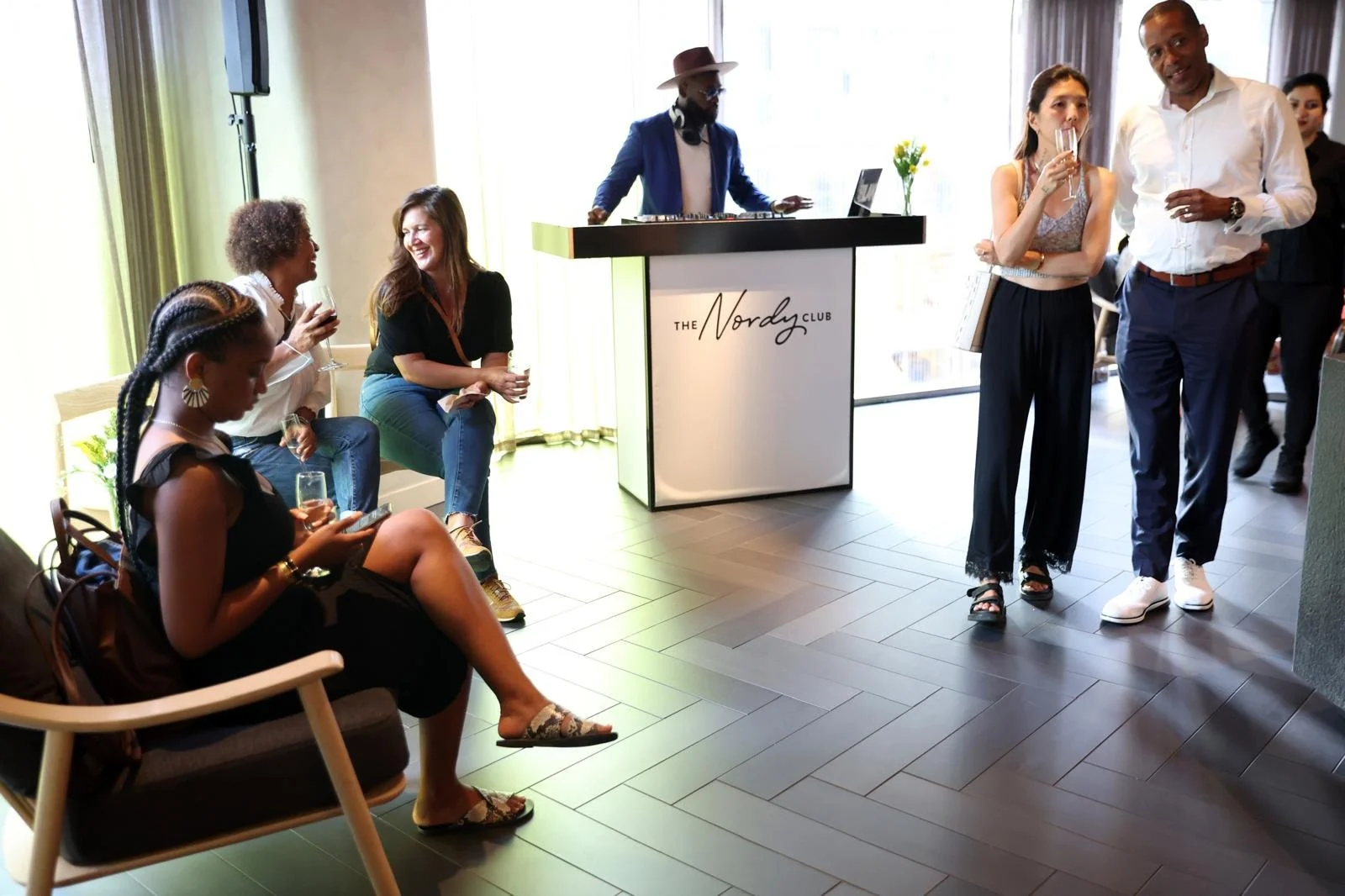 “NYC Wedding DJ & MC DJ Jon Blak providing live music at a stylish corporate networking event, creating an elegant atmosphere for weddings, corporate events, and sports events in New York City.”