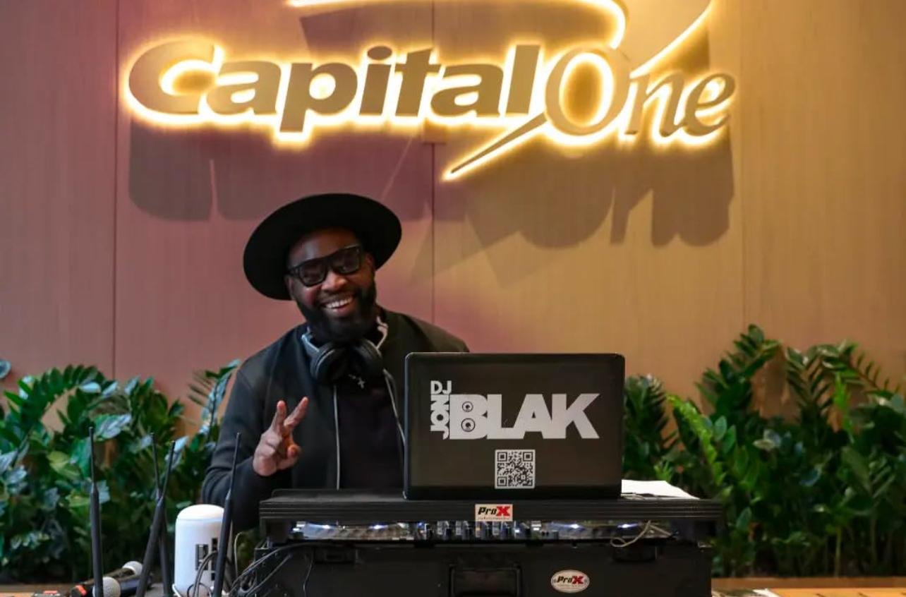NYC Wedding DJ & MC DJ Jon Blak performing live at a branded corporate event, delivering professional DJ services for weddings, corporate events, and sports events in New York City.