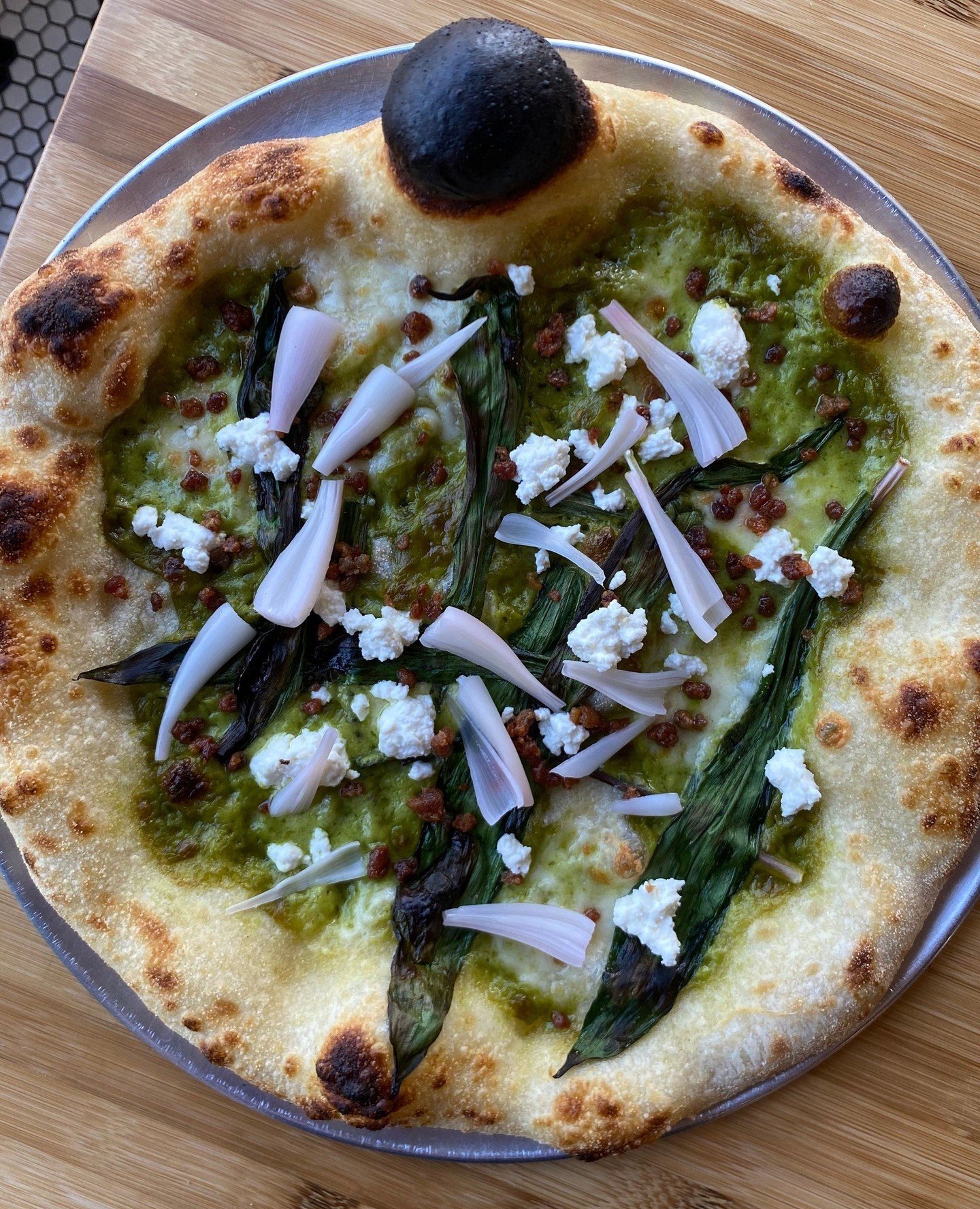 We've got a special za running this week! Wild ramps are only in season for a short time each spring, come and get it! 🍕⁠
⁠
✦ locally sourced wild ramps⁠
✦ scallion cream⁠
✦ fior di latte⁠
✦ prosciutto crumble⁠
✦ pickled ramp bulbs⁠
✦ house lemon ri