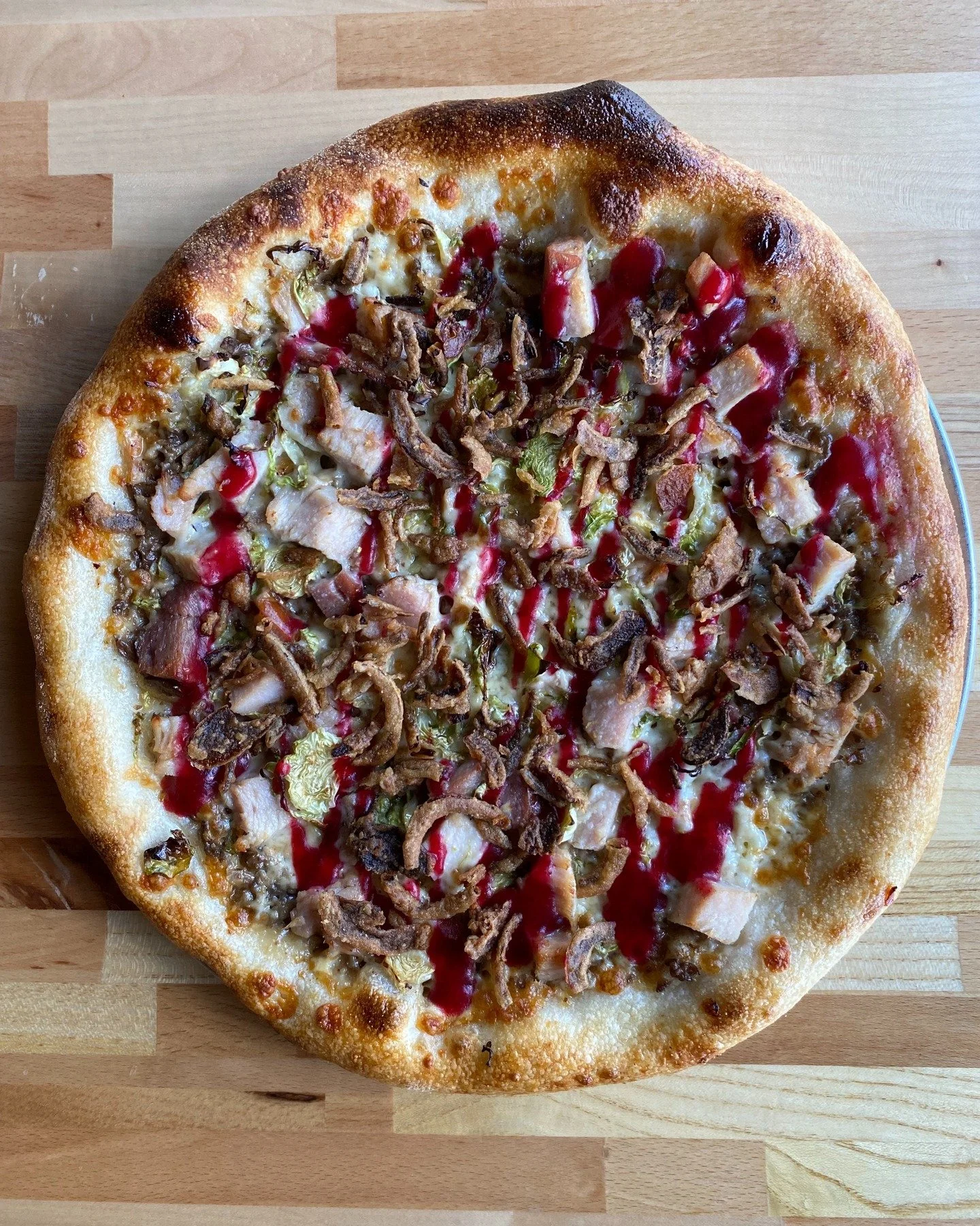 We put Thanksgiving dinner on a pizza because&hellip; why not? 👀🦃

&bull; Creamed mushrooms
&bull; Brussel sprouts
&bull; Applewood smoked turkey
&bull; Mozzarella
&bull; Cranberry sauce
&bull; Onion crisp

Available through the weekend! Dine in on