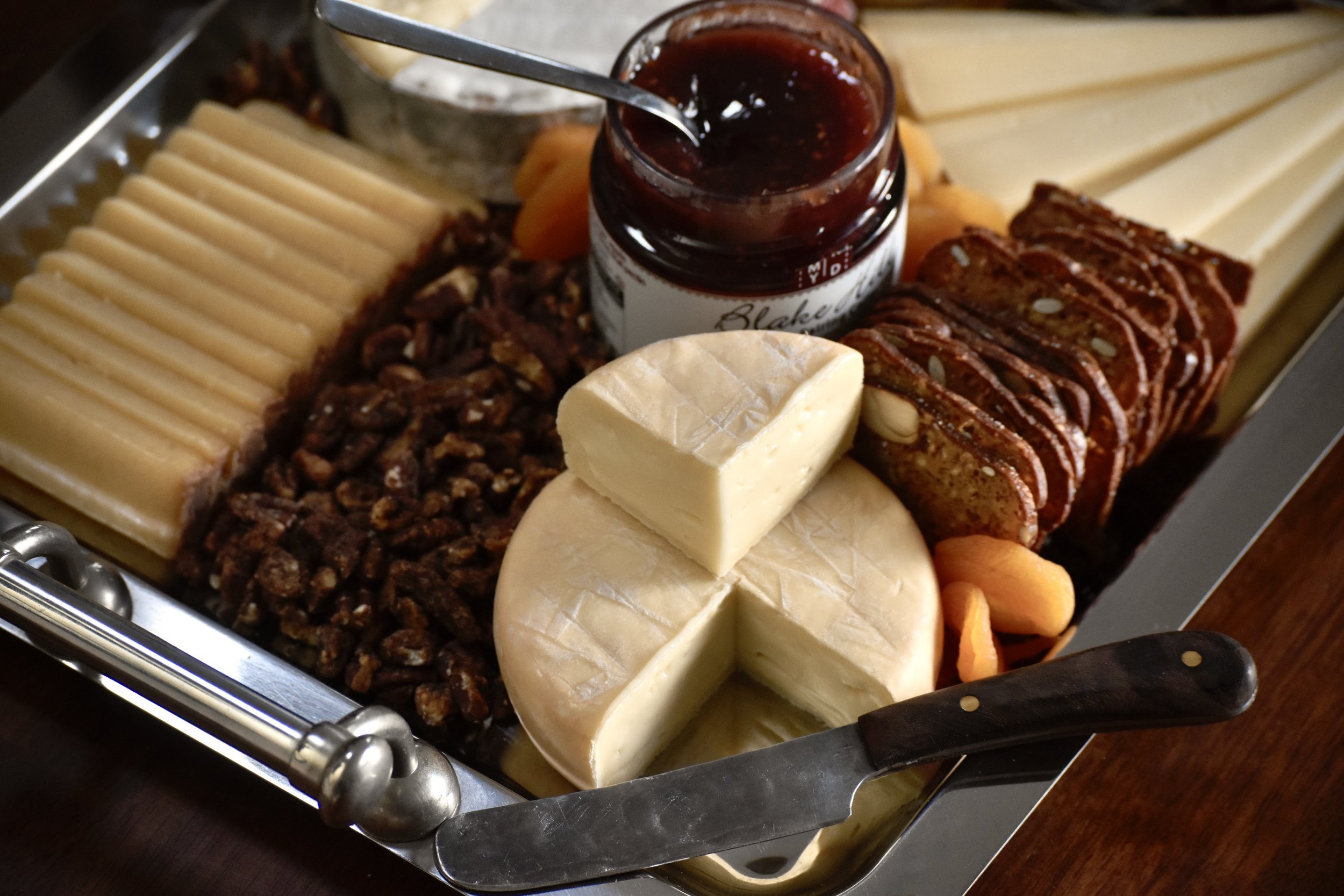  A festive spread of cheese, crackers, and jam  