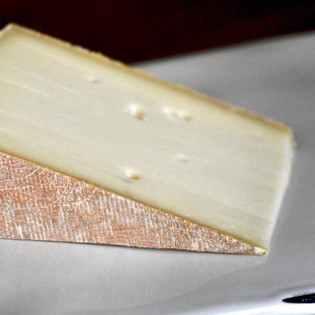 Close up of the paste of Whitney, an alpine style cheese that's made to melt