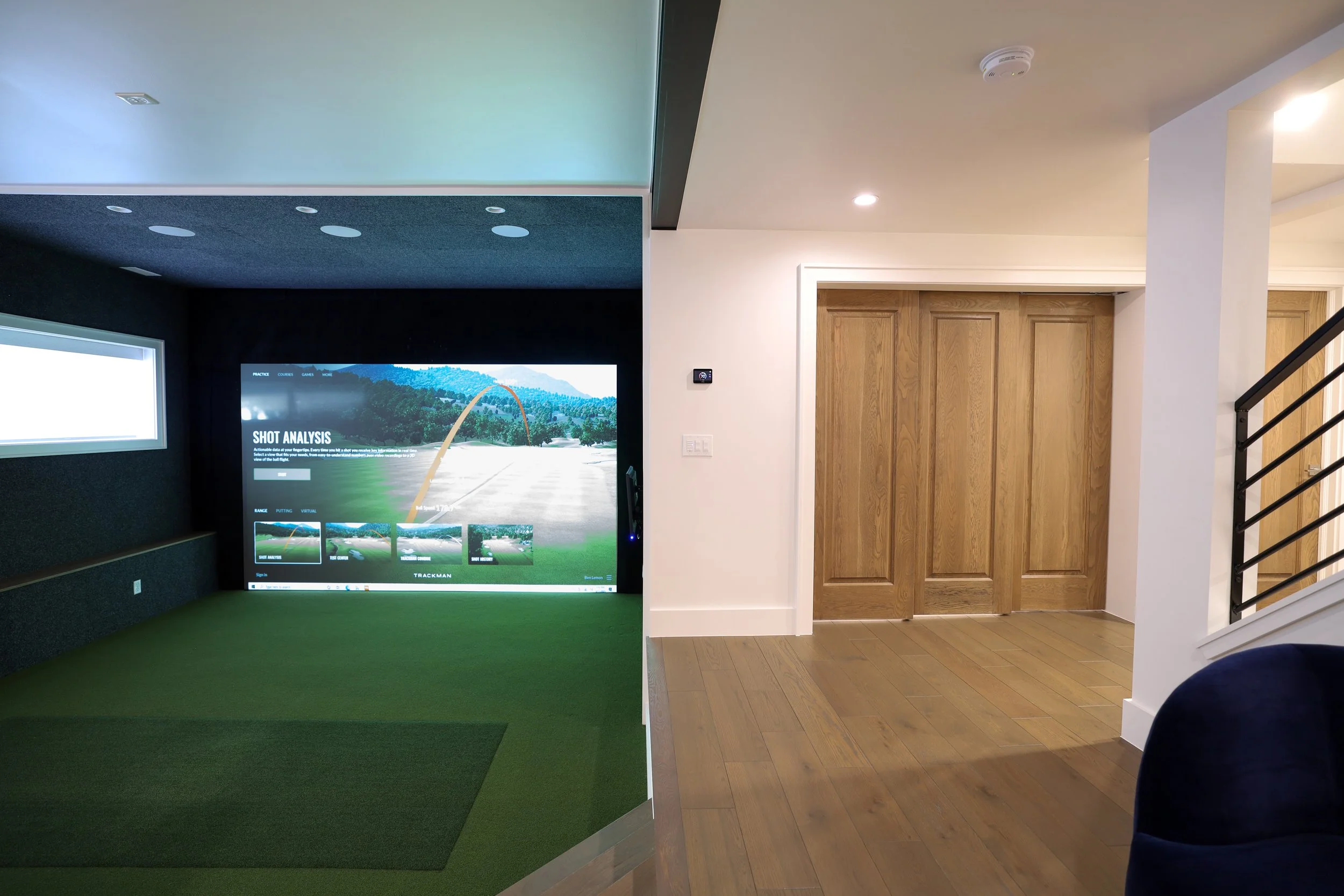 Bluerock Builders_Custom Home Builder_Basement Finishing_Golf Simulator_Sandy, Utah_entertainment space.jpg