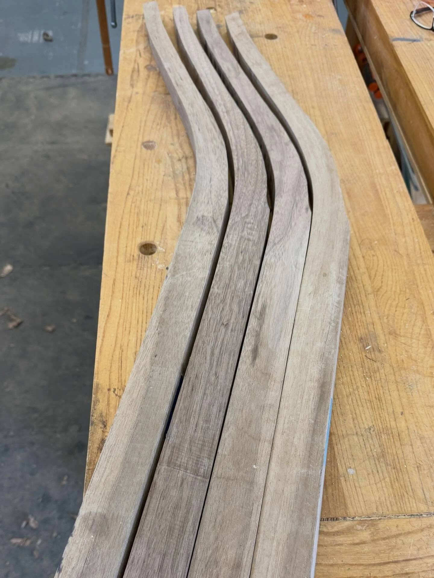 Four rear chair posts in walnut shaped and tapered prior to cutting the slat mortises.

#chairmaker #chairmaking