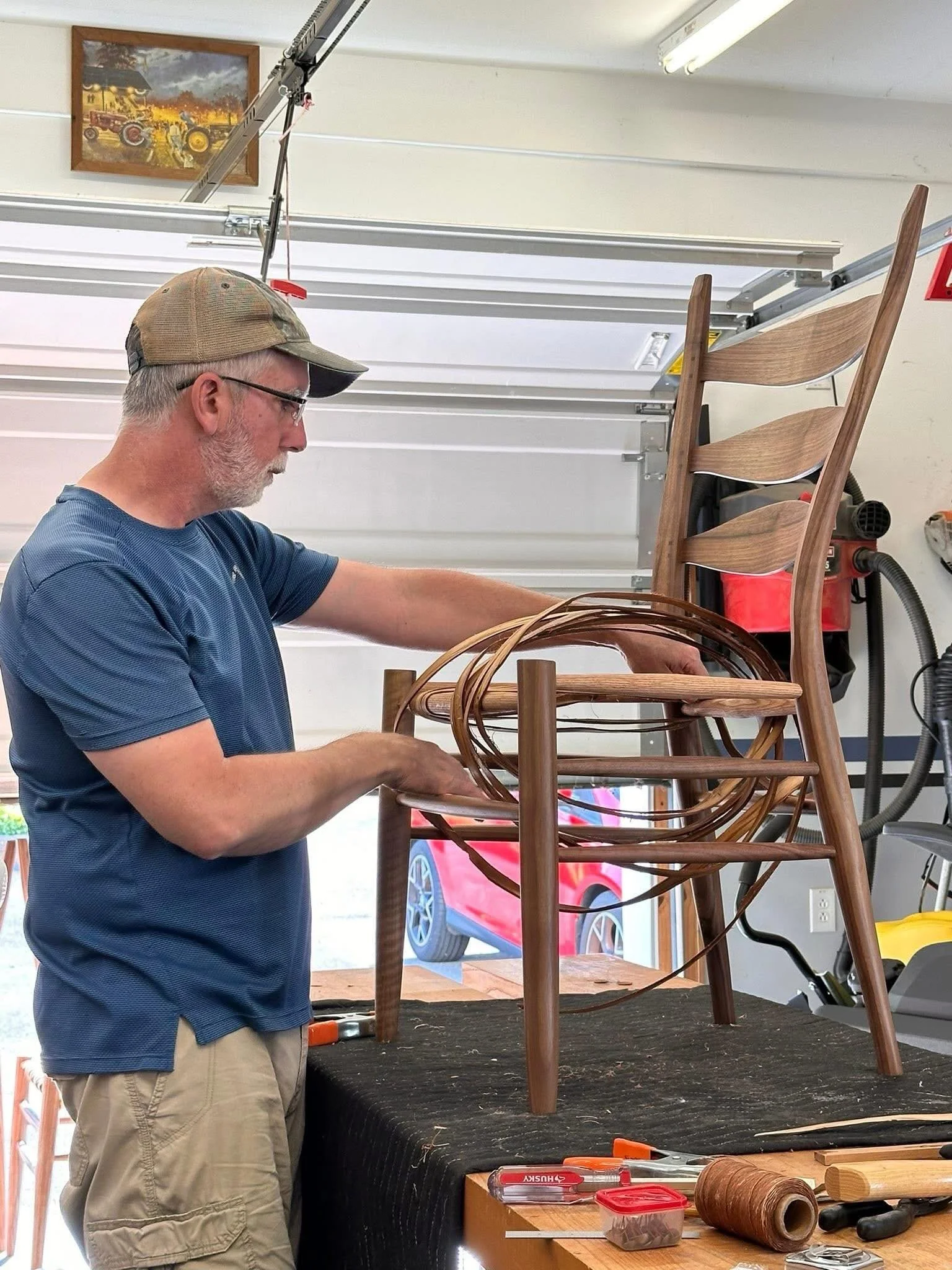 I'm weaving the seat in the fourth chair of a set of six.  We're delivering the first four to the client in New York next week.  Cristie got roped in to cleanup and sand the seat in the third one.  The seats will get some polymerized linseed oil and 
