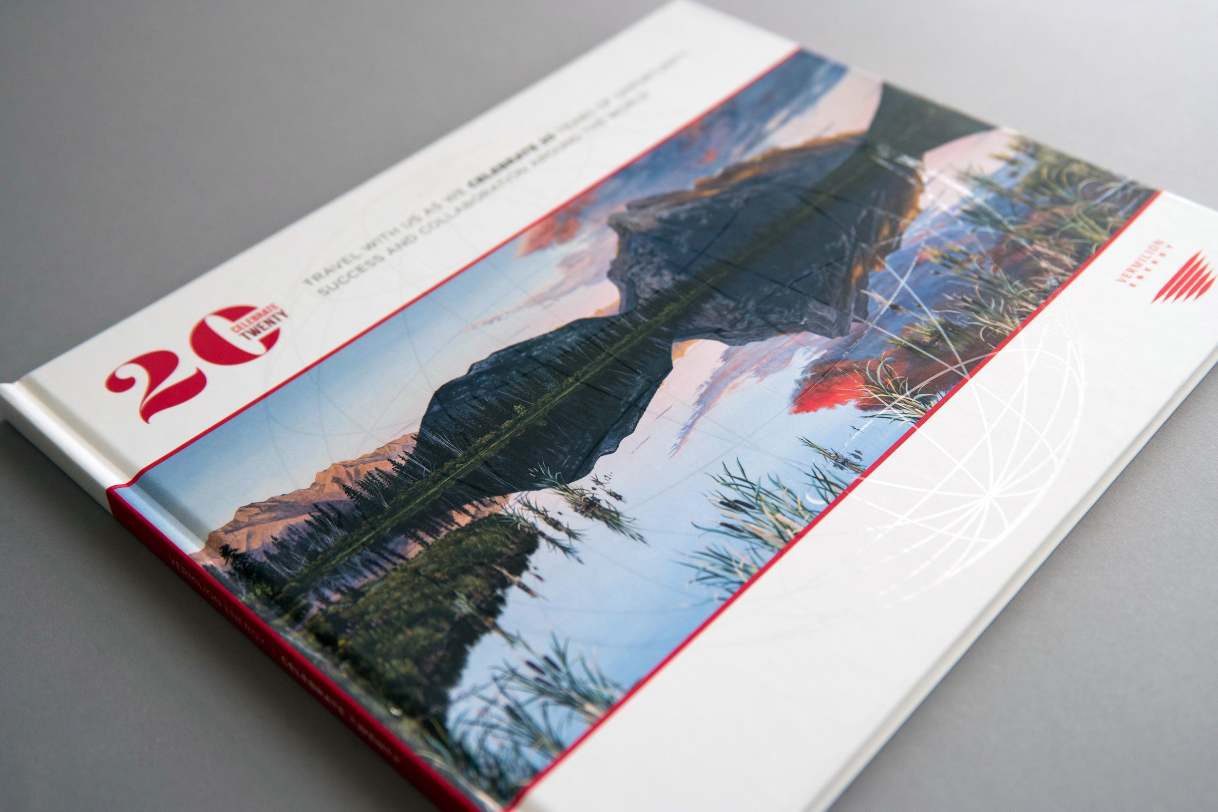 A hardcover book designed with a soft touch exterior for a luxurious finish. High gloss strike-through design elements and vibrant colour integrity was achieved through UV LED printing.