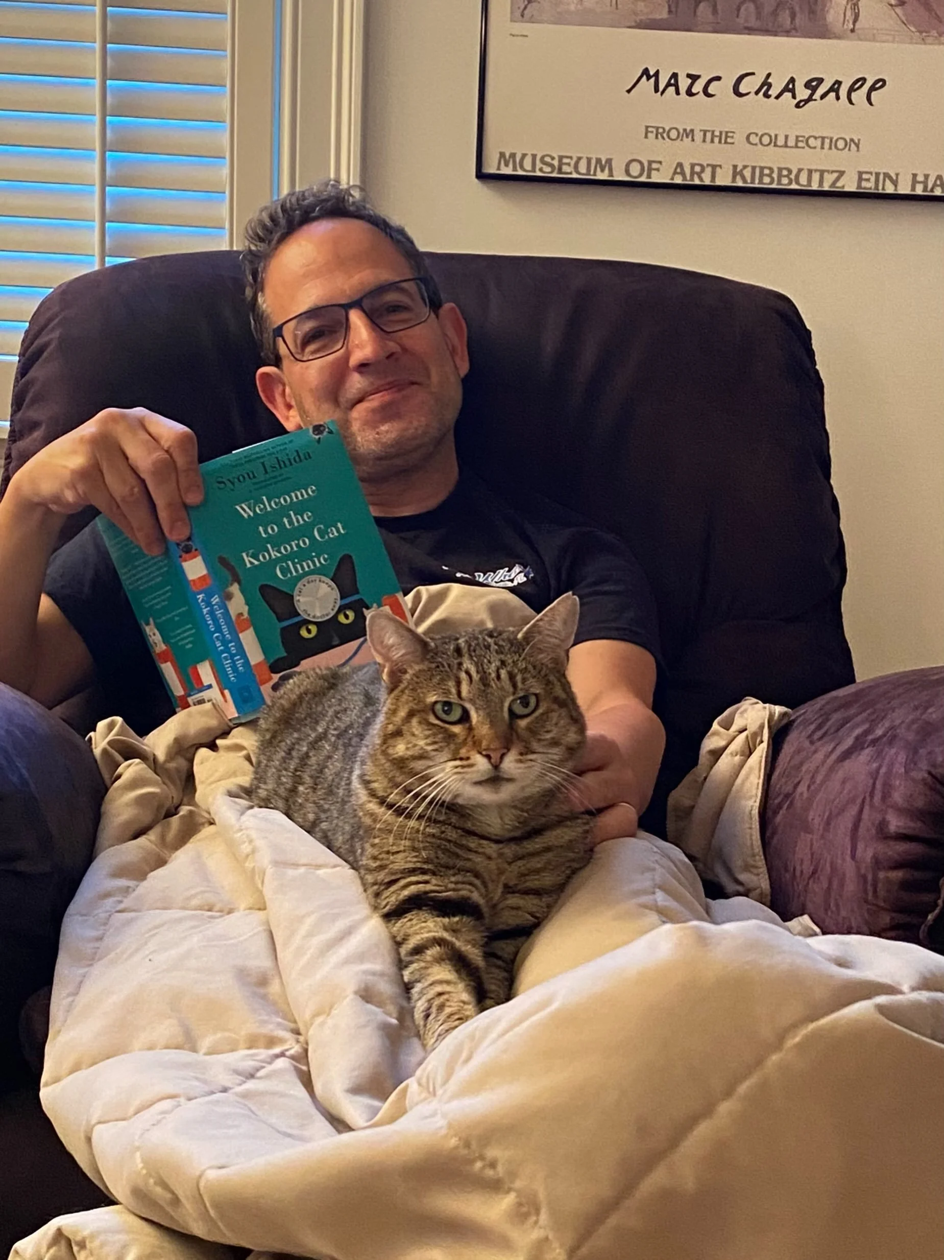 In celebration of Labor Day, we&rsquo;re taking a break with a good book (about cats of course) and cuddling with KCC alum, Piper! 📚😻

If you&rsquo;re looking for a book rec, we&rsquo;re enjoying this third installment in the Japanese series, &ldqu