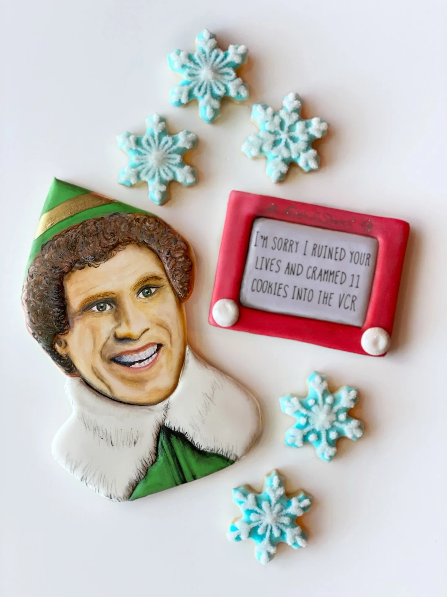 I&rsquo;m sorry I ruined your lives, and crammed 11 cookies into the VCR.

Decorated this cookie in a class from @lucie.bakes 
She&rsquo;s the master of portrait cookies!!!

#houstonbakery #elf #elfcookies #houstoncookies #decoratedsugarcookie