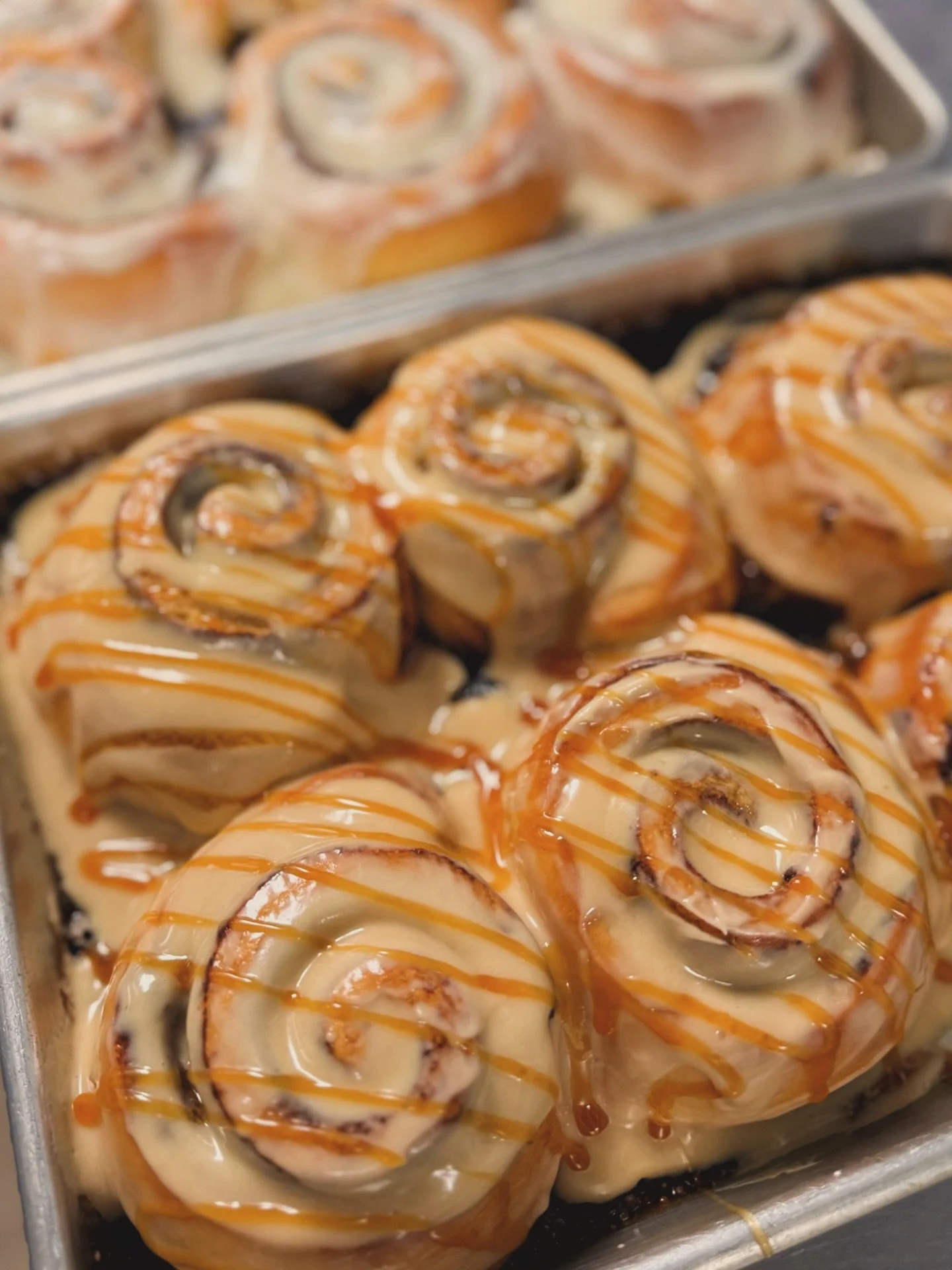 Did you know that every month we feature a specialty bun alongside our classic cinnamon rolls?
Meet our Salted Caramel Espresso Rolls:
Espresso-infused filling, salted caramel swirl, espresso cream cheese frosting, and a drizzle
of even more caramel 