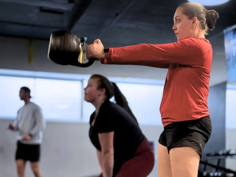 woman kettlebell swings