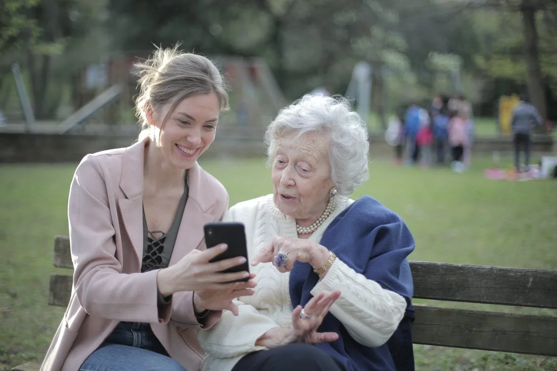 Woman helping elderly woman.jpeg