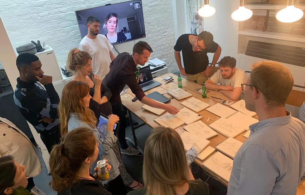Founders sketching and working around a table