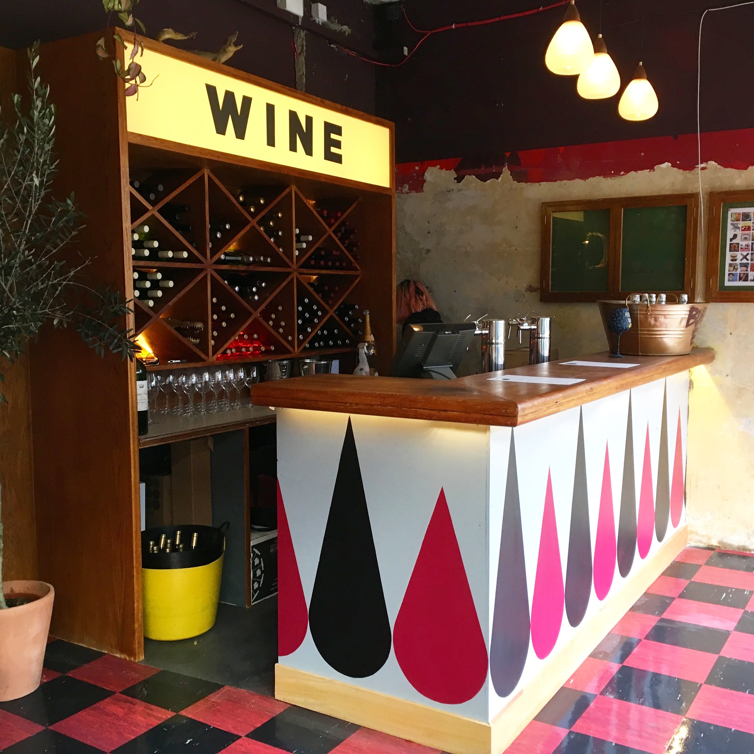 Winyl (vinyl & wine bar) bar frontage - wine drop design at Model Market in Lewisham.