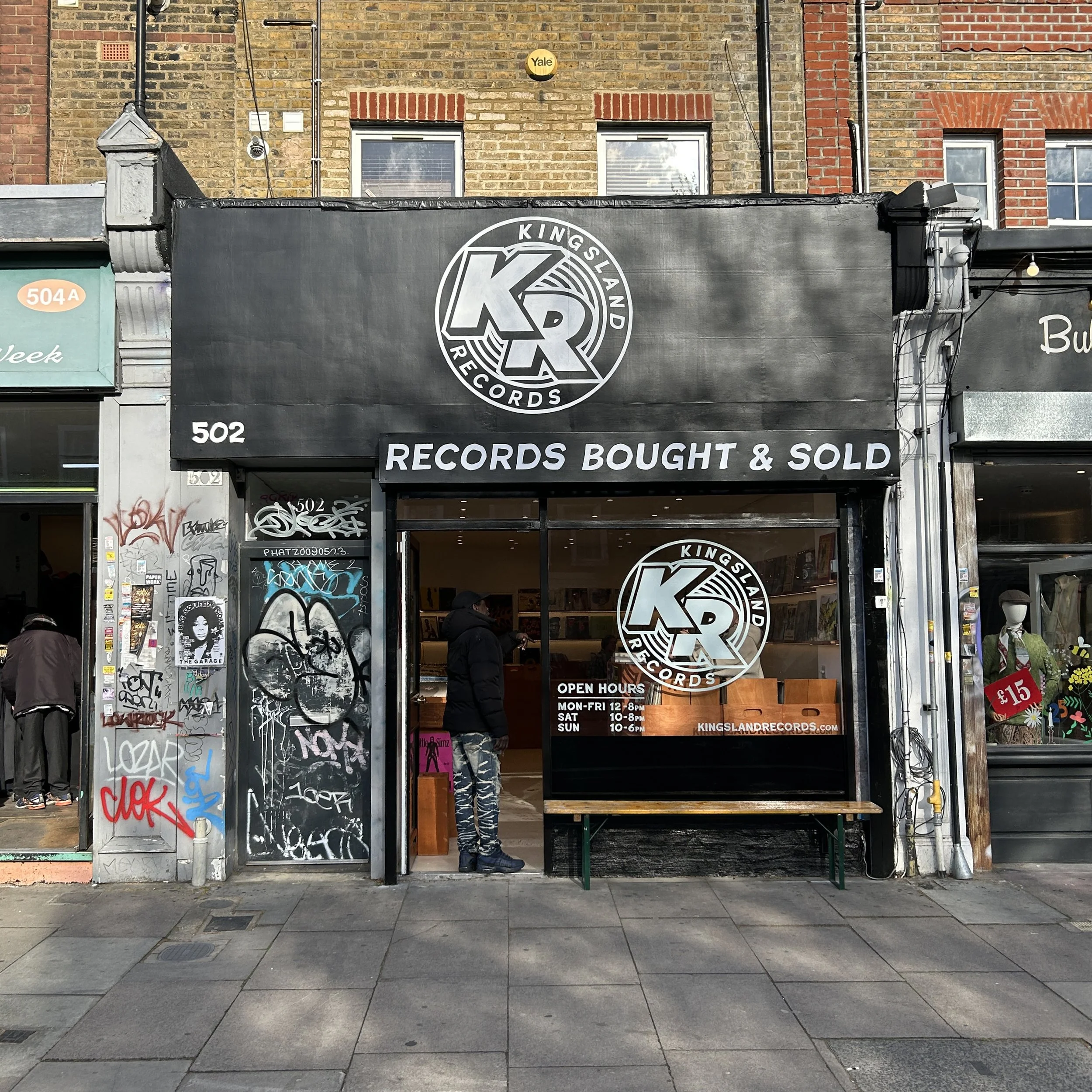 Hand painted signage for the shop fascia, including large reverse glass painted logo on the window, shop number & "Records bought & sold".