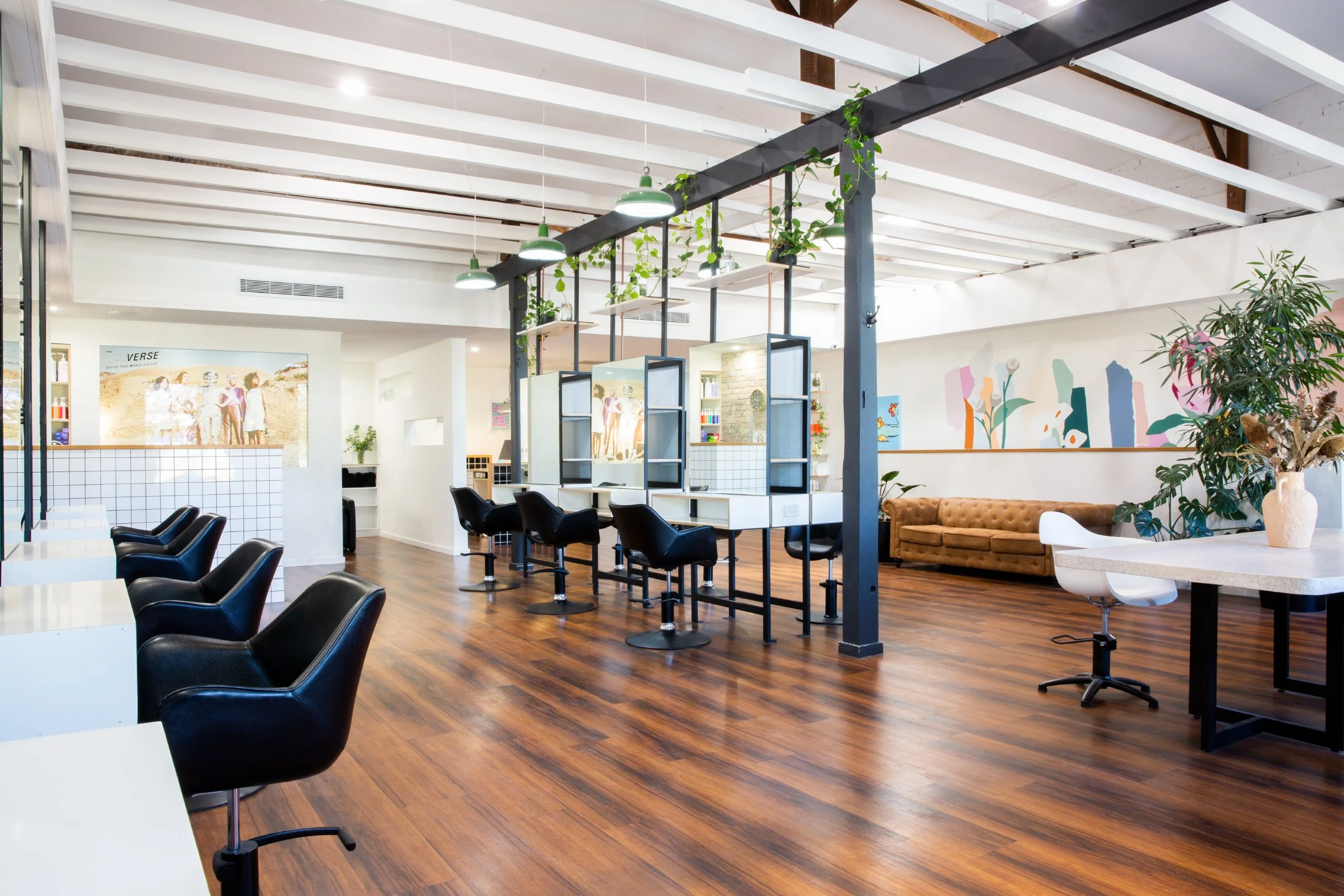 Light-filled salon floor with timber floors and styling stations at Maverick Hair Salon in Coolangatta