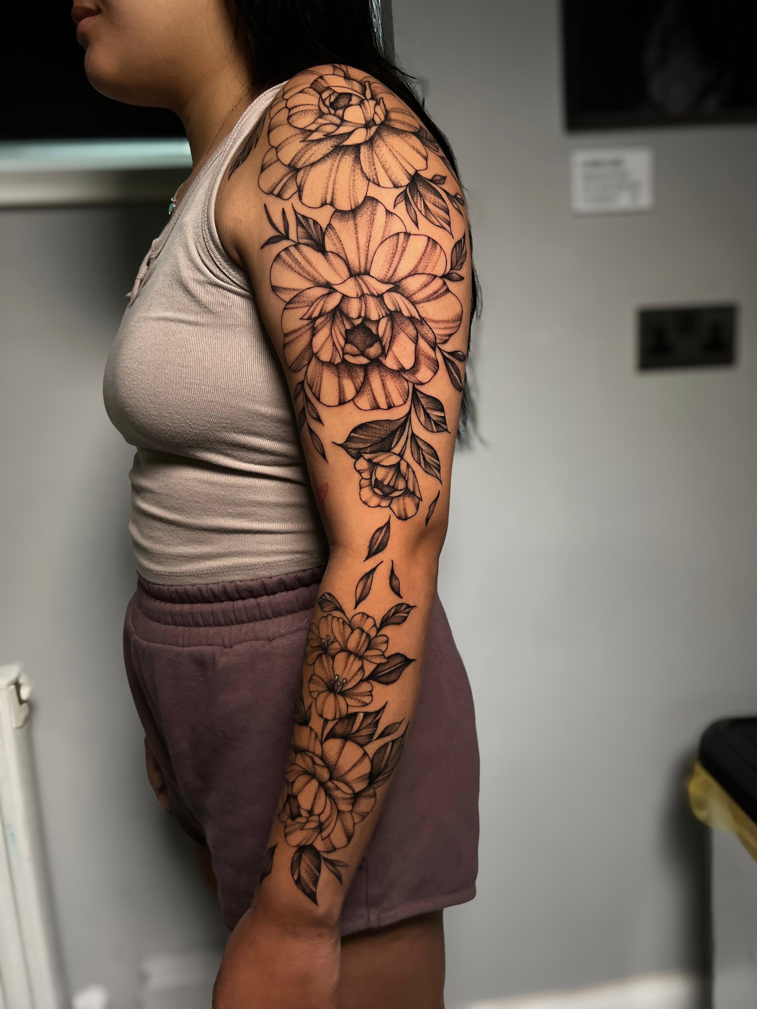Liv Hornblower floral sleeve tattoo