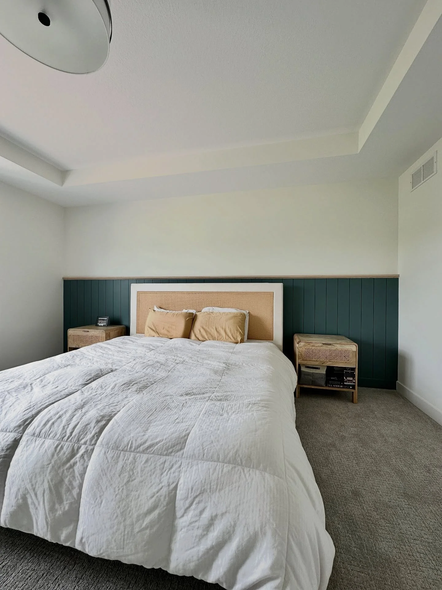 I added a pop of color to this bedroom with simple half wall shiplap design for @newman.Anton.golf  and @kellicshea. The top ledge was done in white oak to tie in the furniture. I love the headboard of this bed. The cane webbing adds a fun texture th