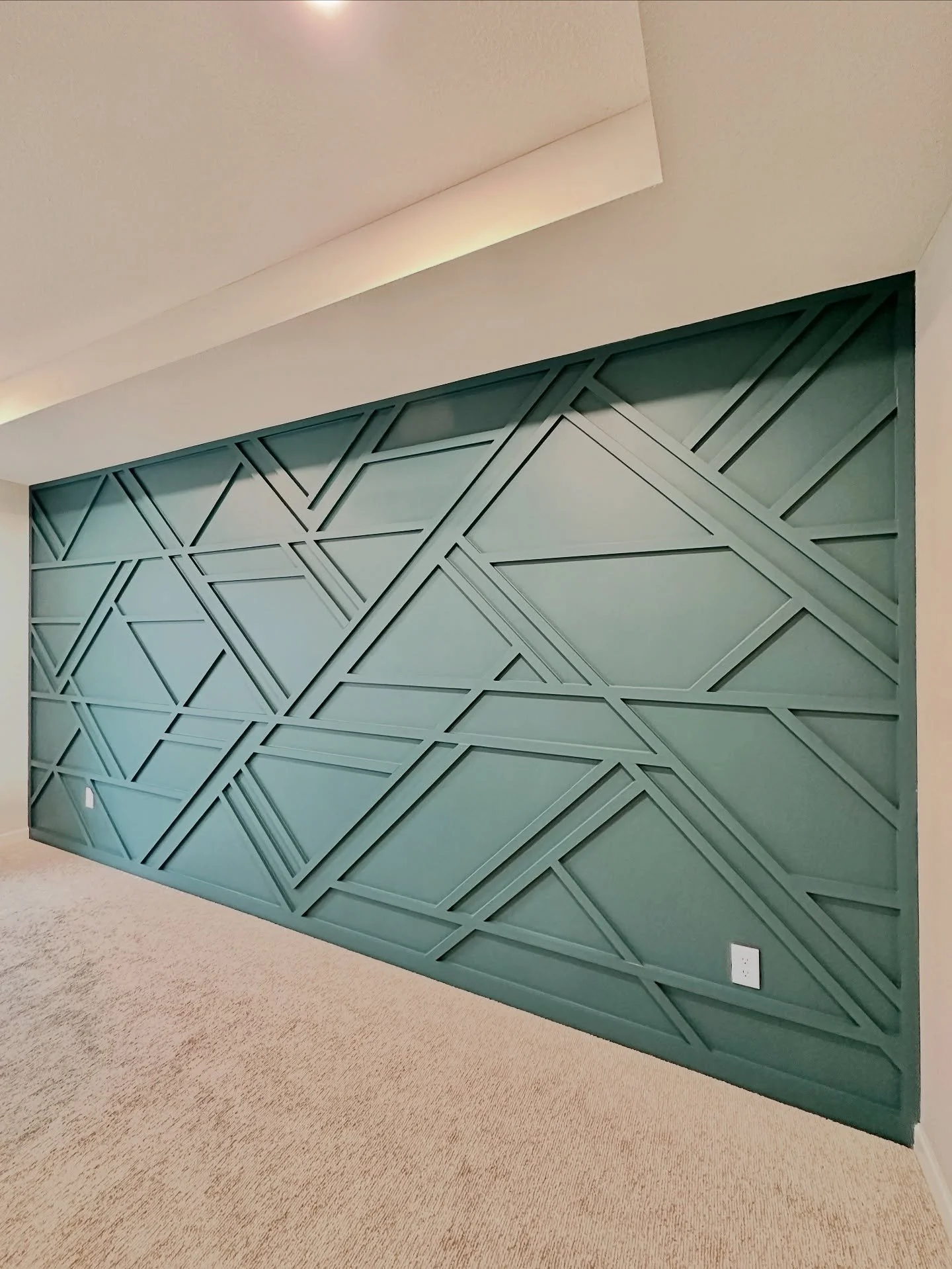 Want to inject some personality into your space? Bold geometric accent walls are a great way to add texture, color, and style to an otherwise boring white or grey room. This is just one example of a layout, but the options are nearly endless when con