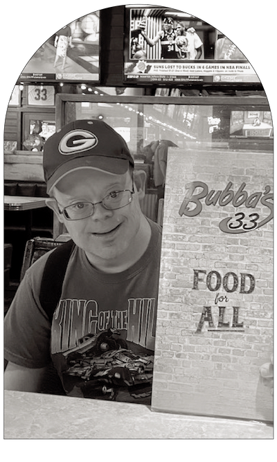 man holding up a restaurant menu