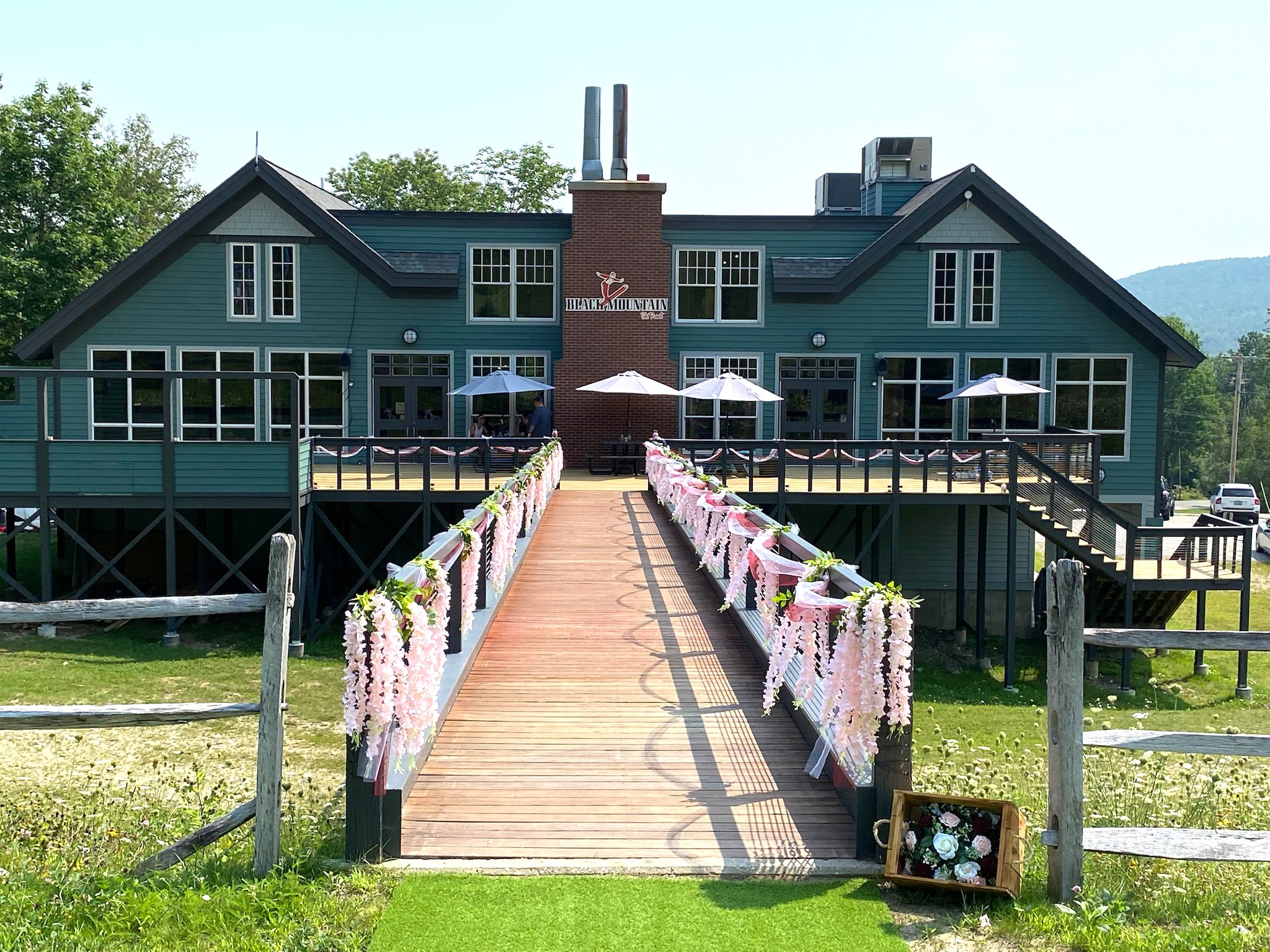 Black Mountain of Maine l outdoor wedding decorations at ski area lodge l flowers aisle decorations