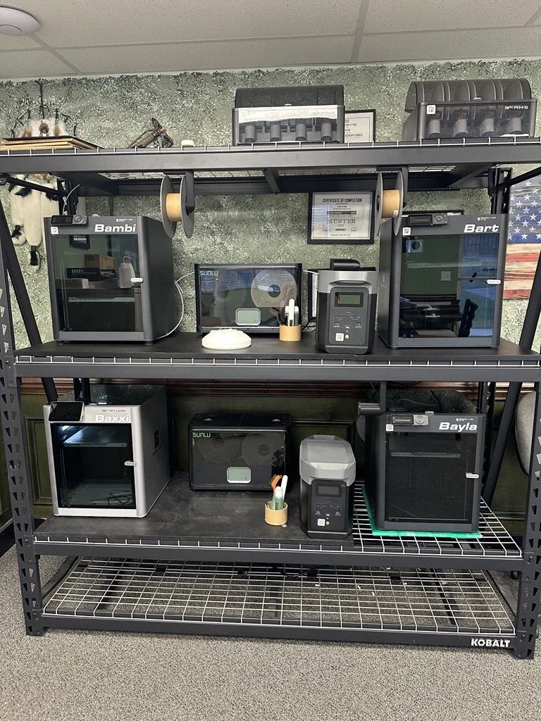 3D Printers on a shelving unit at Accurate CNC Services, an Idaho machine shop