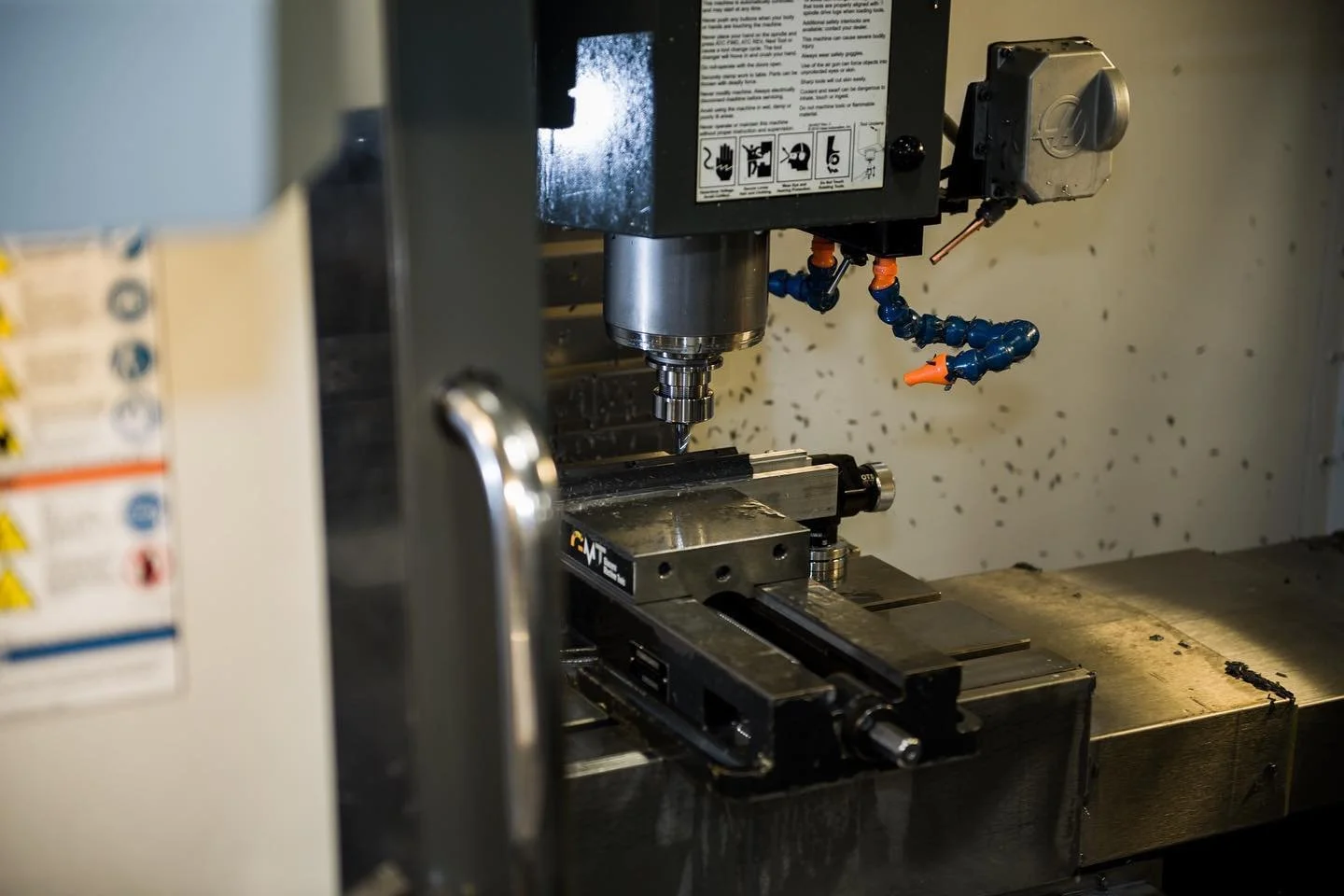 Haas milling center performing operations on an aluminum metal part