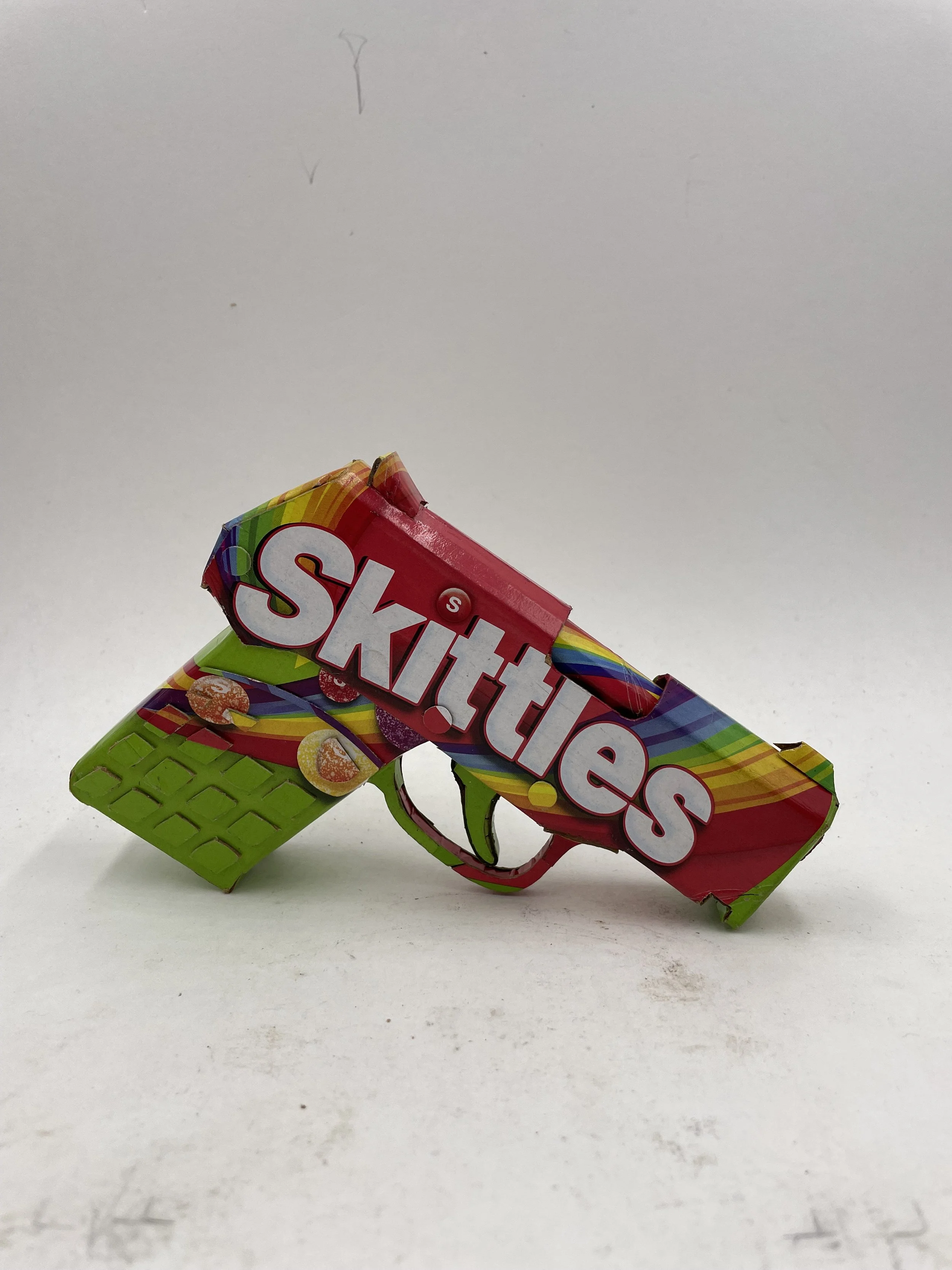 Trayvon Martin shooting gun lobby politics Skittles candy satirical art sculpture