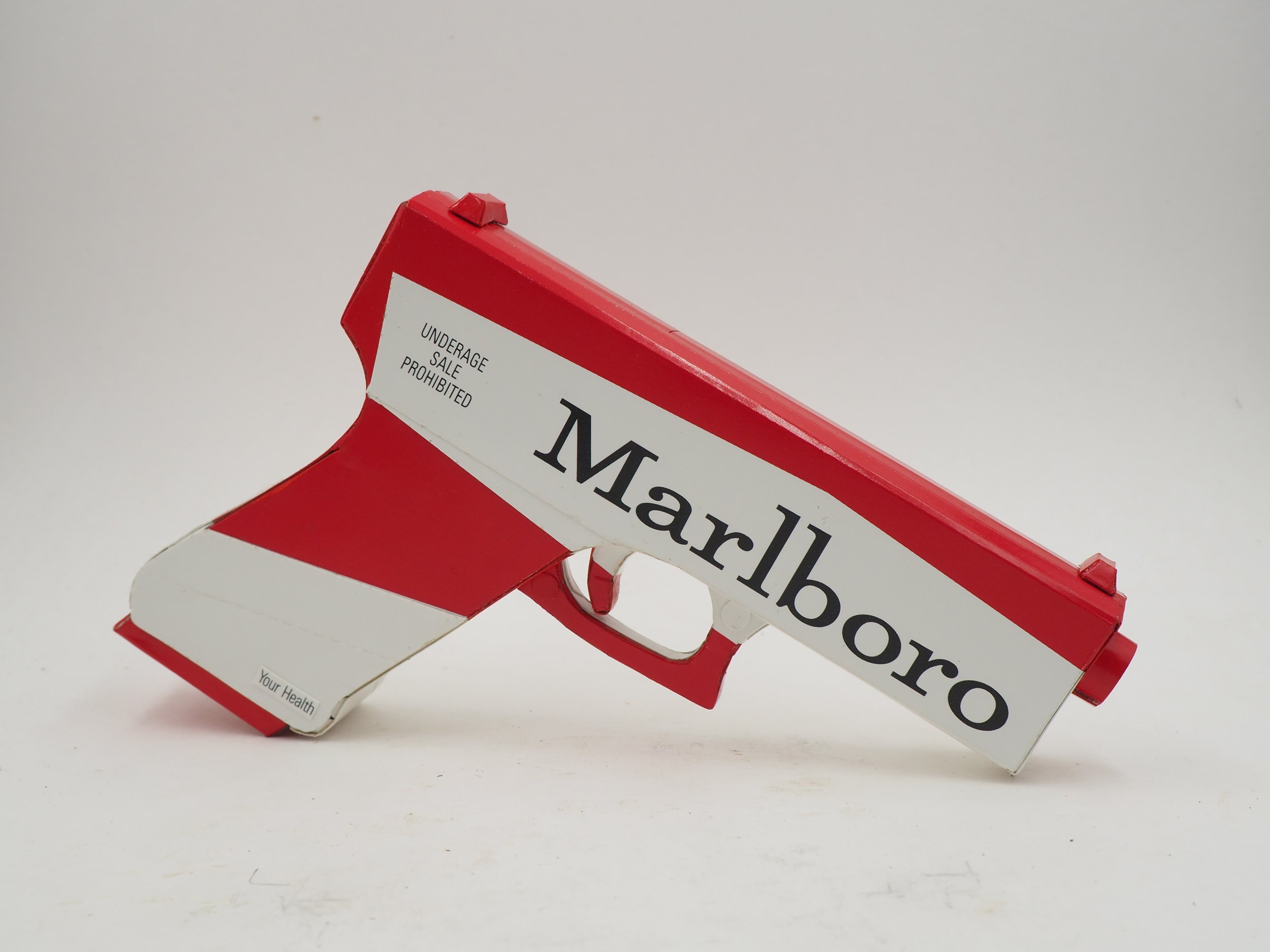 Marlboro smoking gun violence pop art sculpture political lampoon