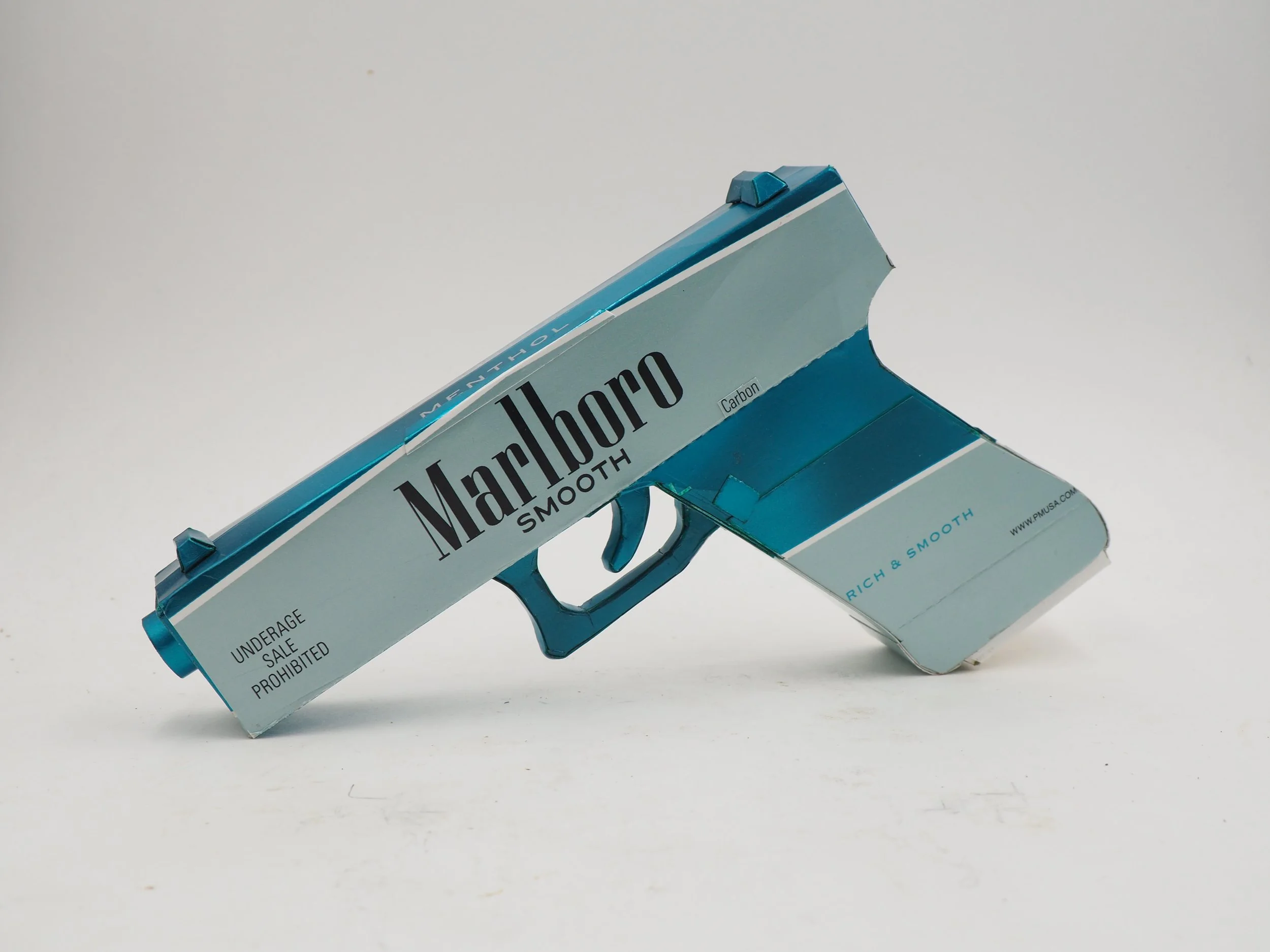 Smoking gun violence art sculpture pop cigarette satire