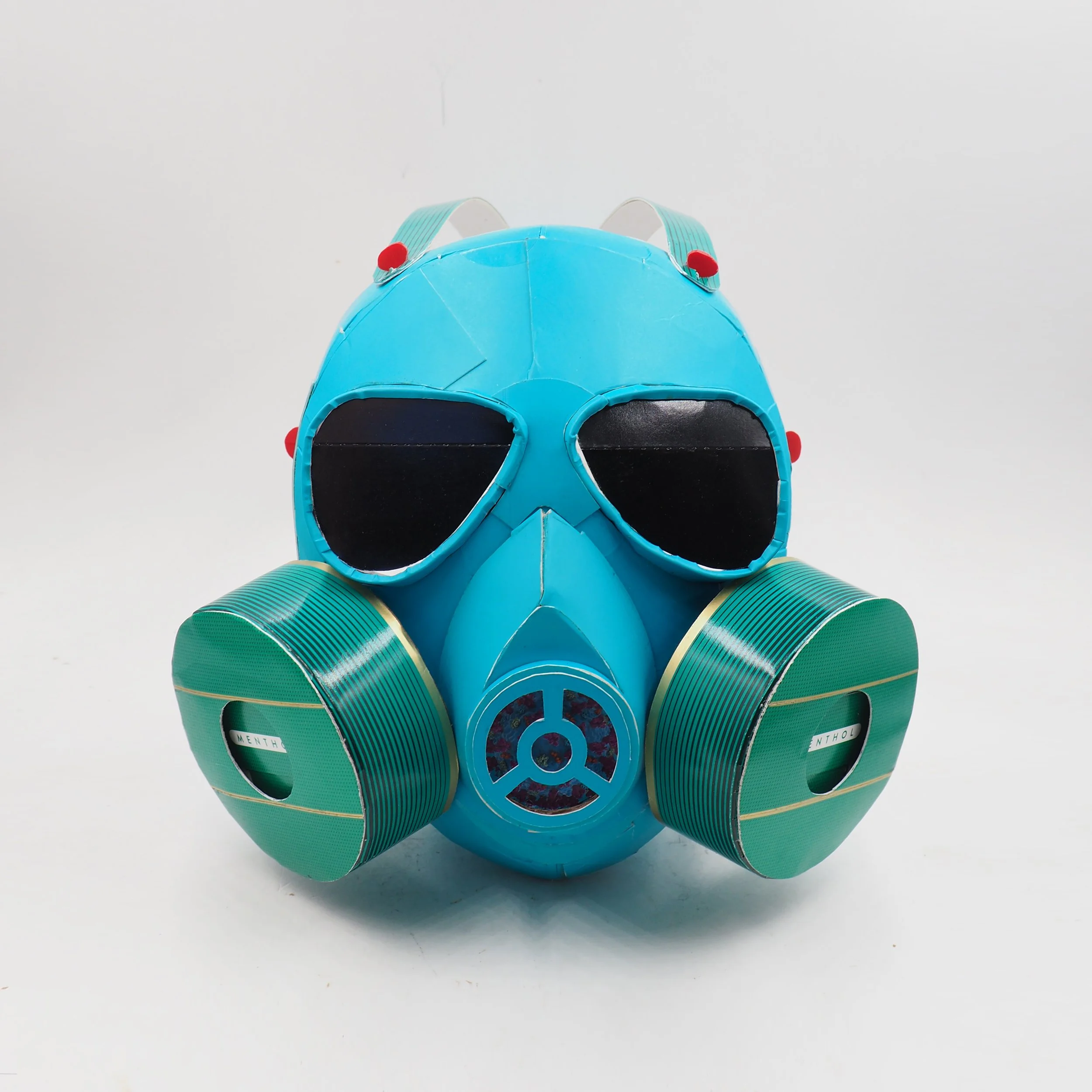 Gas mask 2020 Covid dumpter fire art sculpture recycled material parody