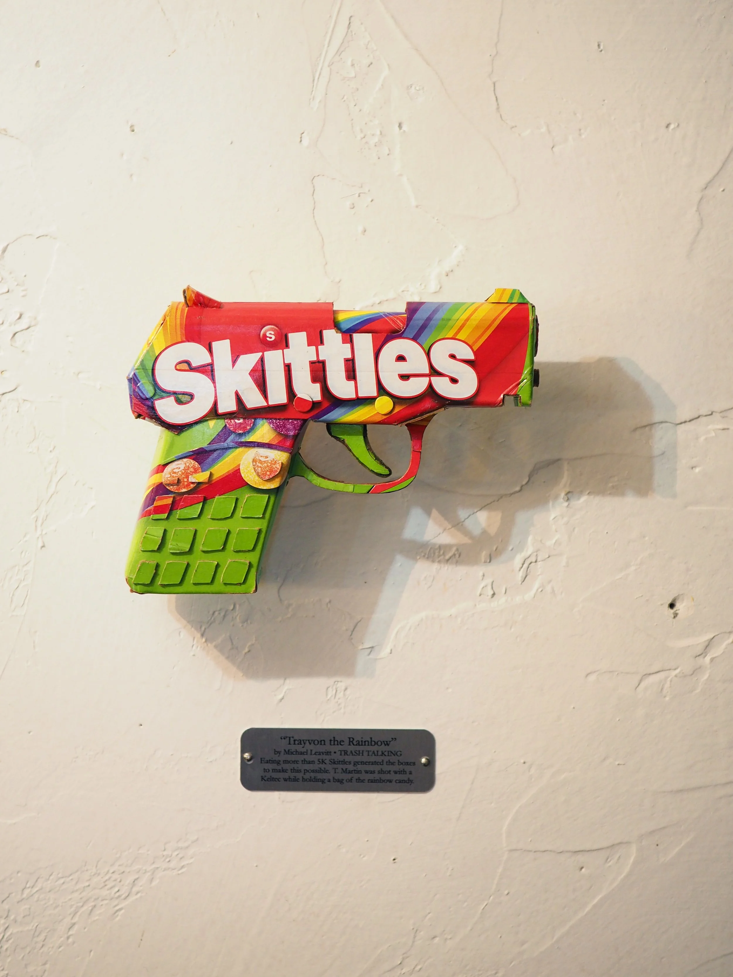 Trayvon Martin shooting gun lobby politics Skittles candy satirical art sculpture