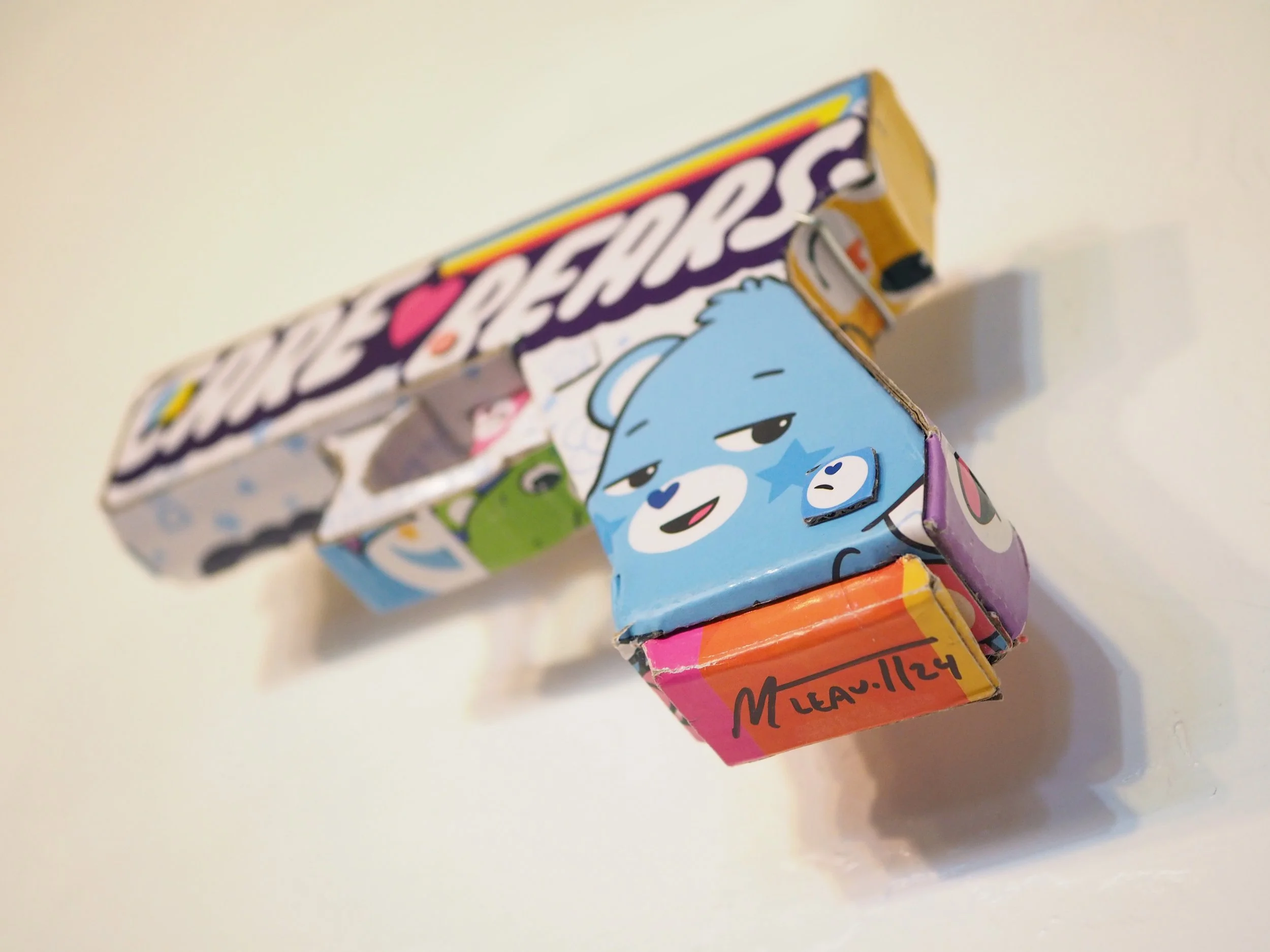 Mass shooting gun violence Care Bears American Greeting Card Company pop art sculpture political parody