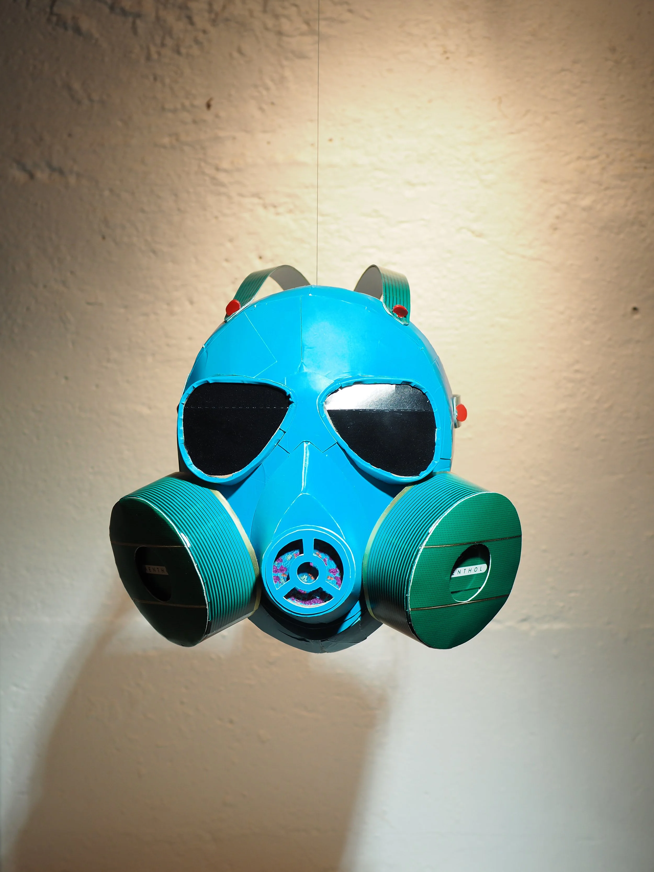 Gas mask fossil fuel industry 2020 George Floyd art sculpture recycled material parody