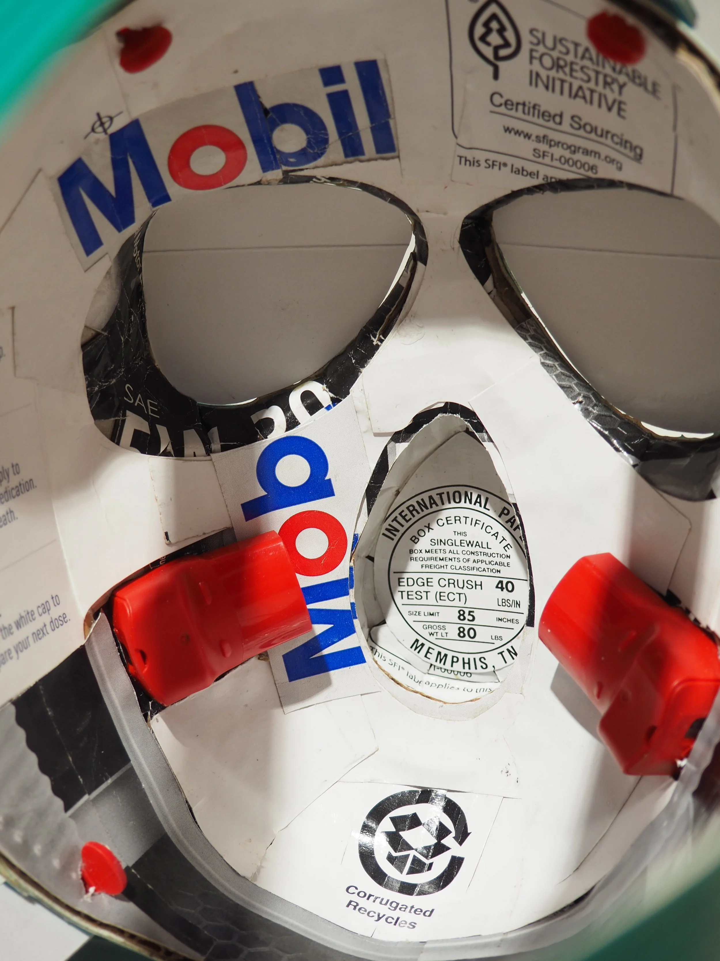 Gas mask fossil fuel industry 2020 George Floyd art sculpture recycled material parody artwork