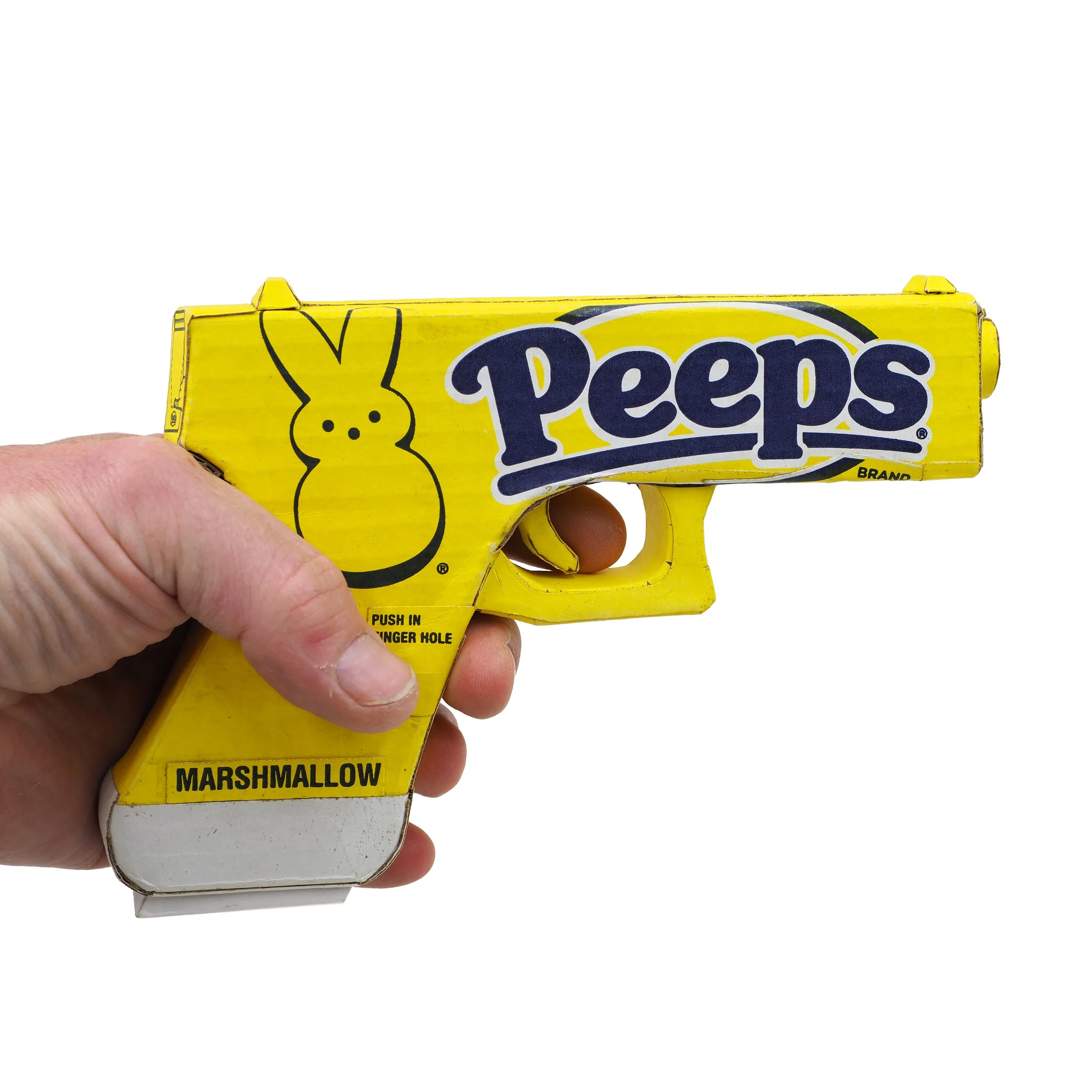 Mass shooting yellow marshmallow Easter candy peeps cardboard recycled material art sculpture political action satire