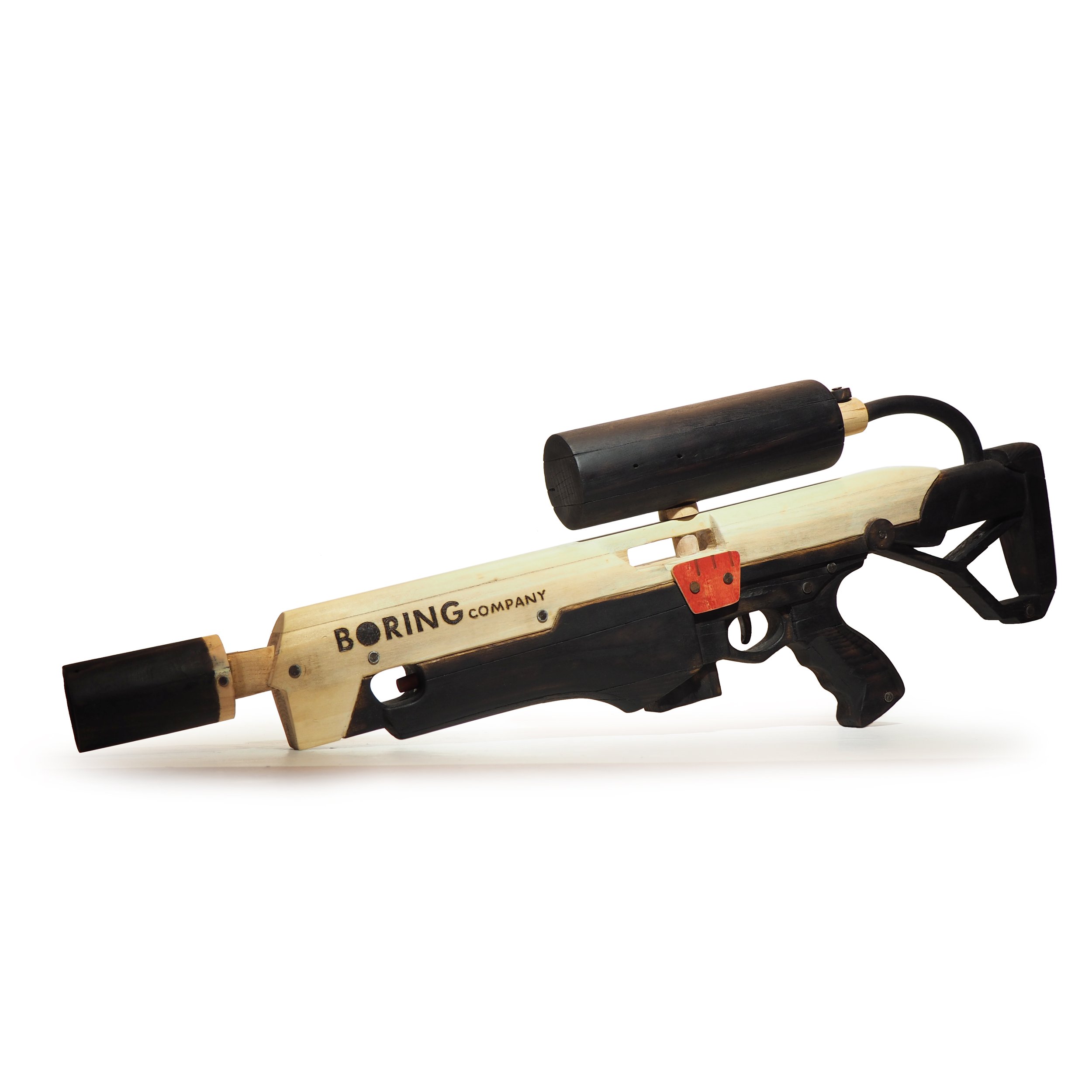 Elon Musk Boring Company flame thrower Twitter X Tesla corporate culture anti-capitalist woodworking wood sculpture recycled reclaimed pallet wood satire celebrity parody art