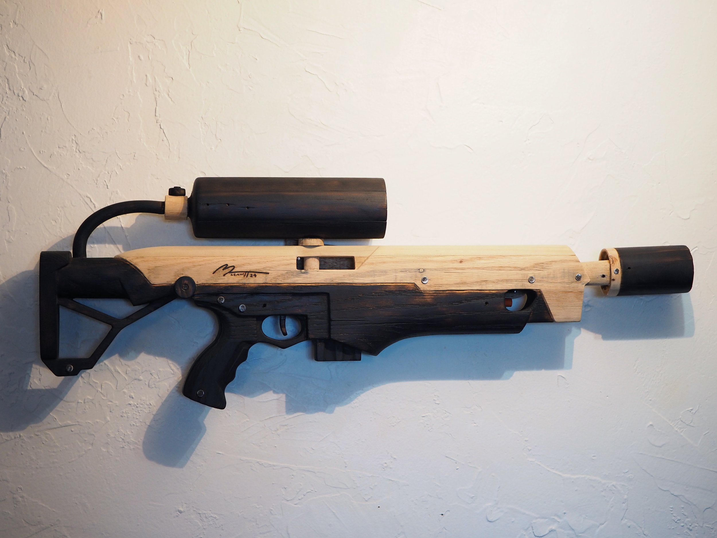 Elon Musk Boring Company flame thrower Twitter X Tesla corporate culture anti-capitalist woodworking wood sculpture recycled reclaimed pallet wood satire celebrity parody art