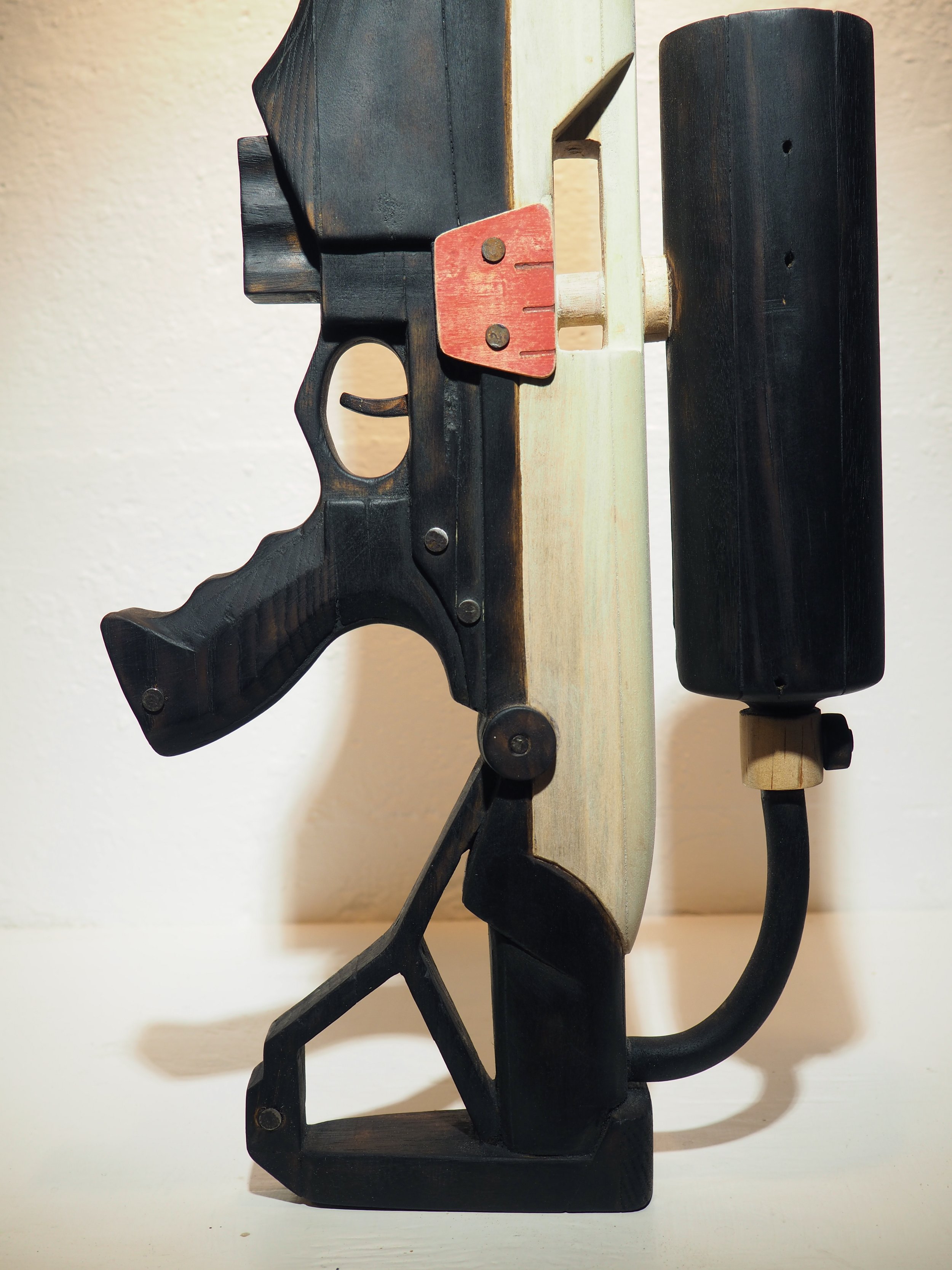 Elon Musk flame thrower Twitter X Tesla corporate culture anti-capitalist woodworking wood sculpture recycled reclaimed pallet wood satire celebrity parody art
